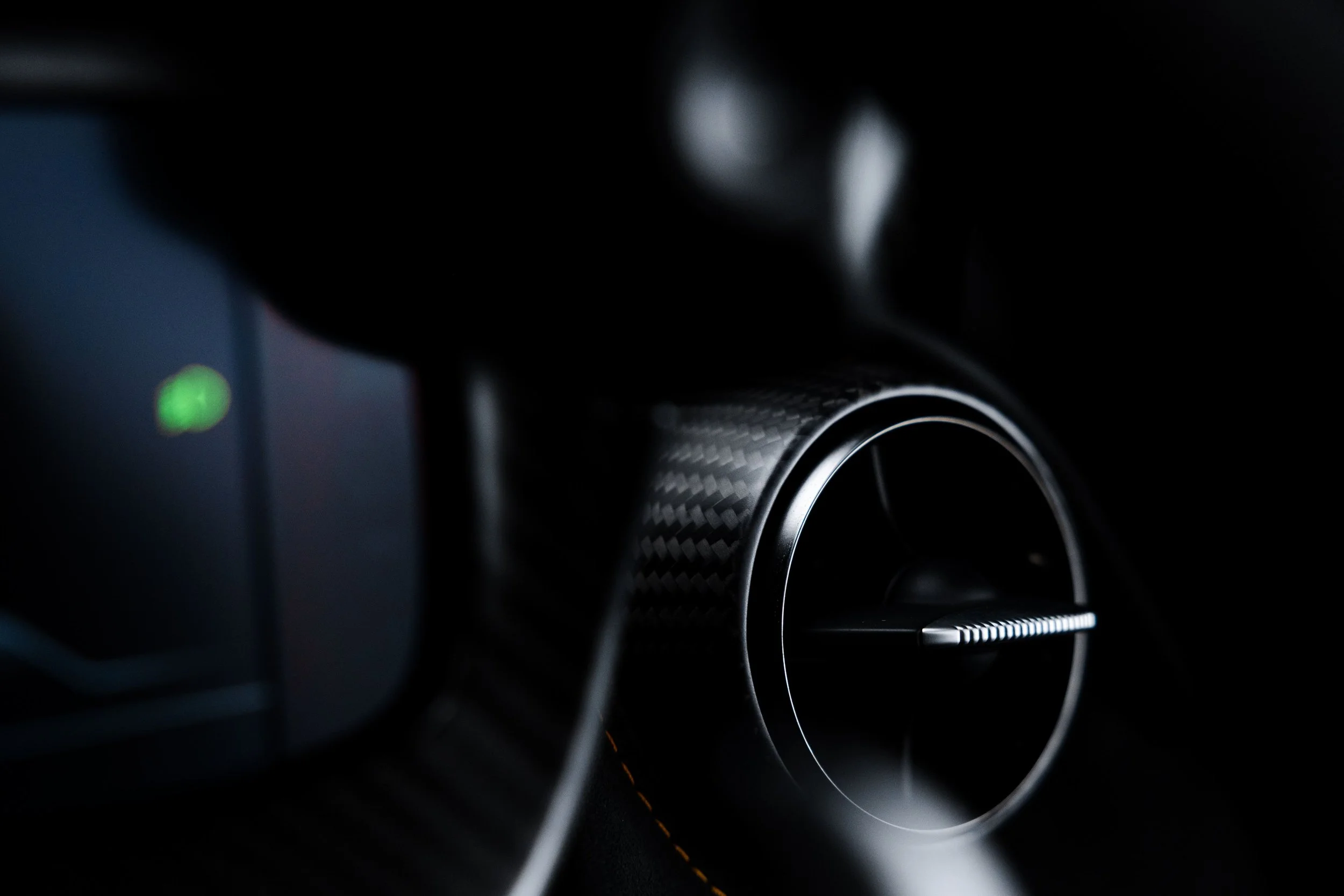 Black McLaren 750S interior detailing air vent and carbon fibre trim in Sydney