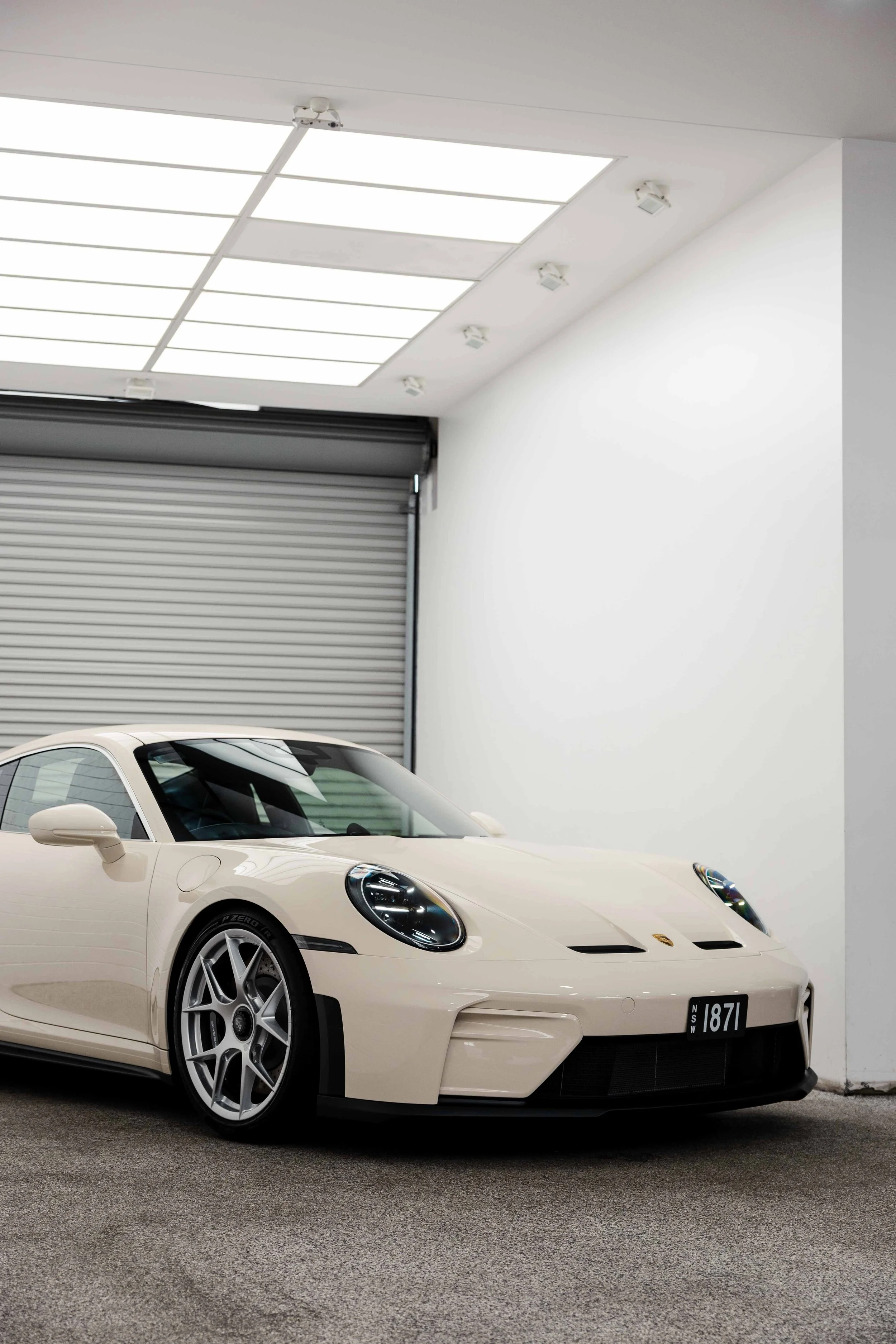 Cream Porsche 911 GT3 Touring front three quarter in studio with XPEL Paint Protection Film in Sydney