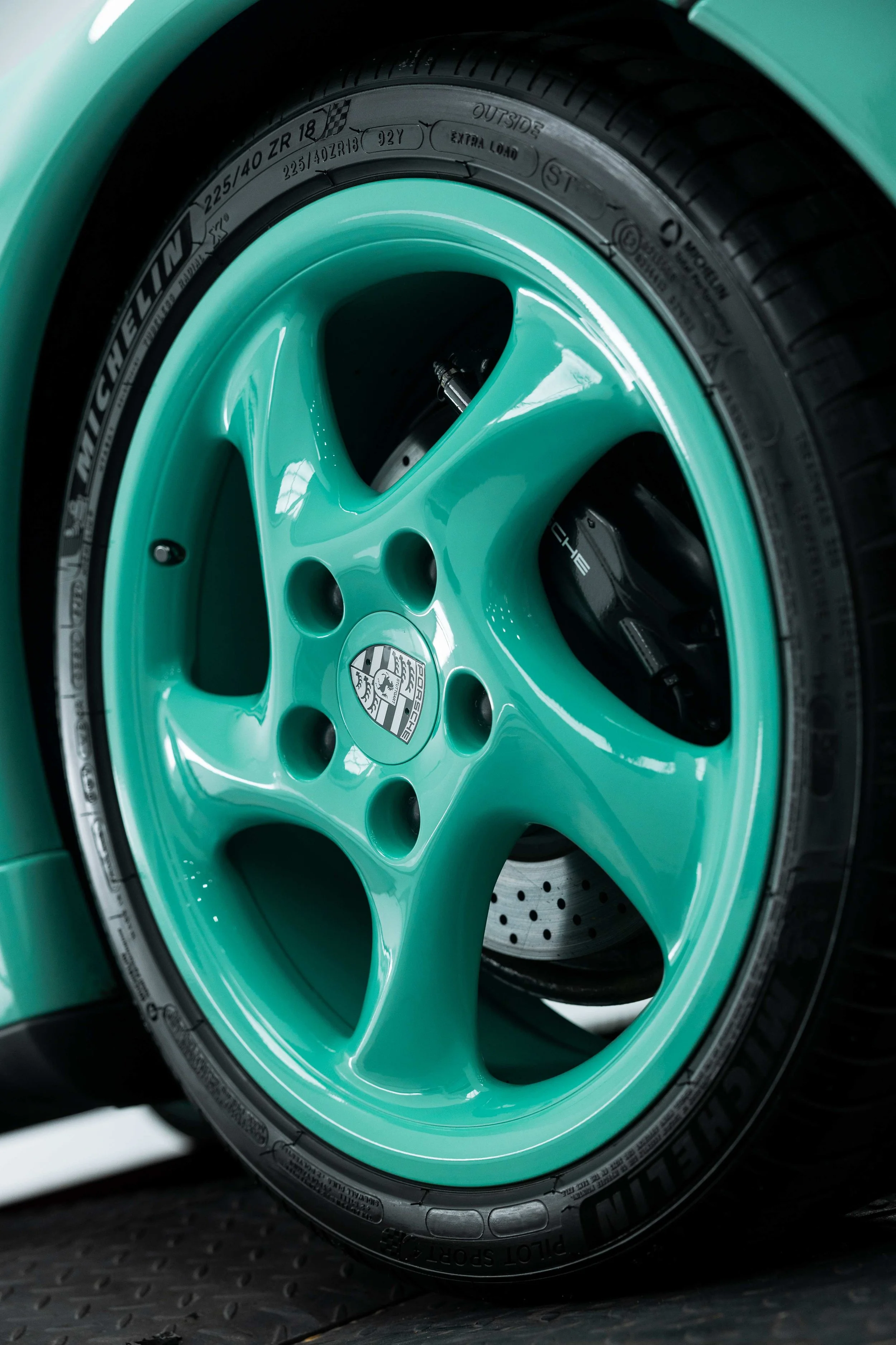 Mint green Porsche 993 alloy wheel and brake caliper with XPEL Paint Protection Film in Sydney