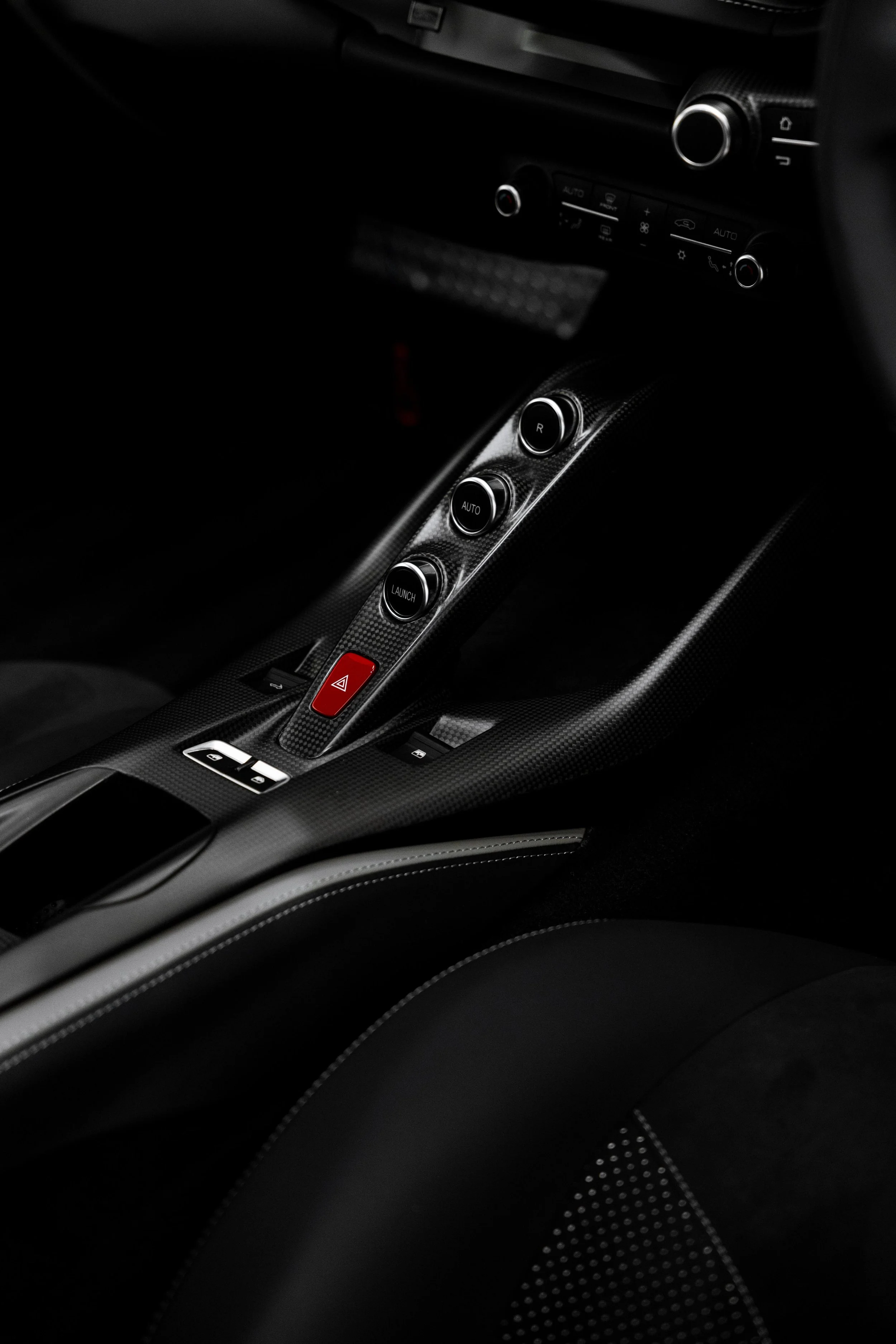Red Ferrari 812 GTS interior detailing centre console switches in Mona Vale
