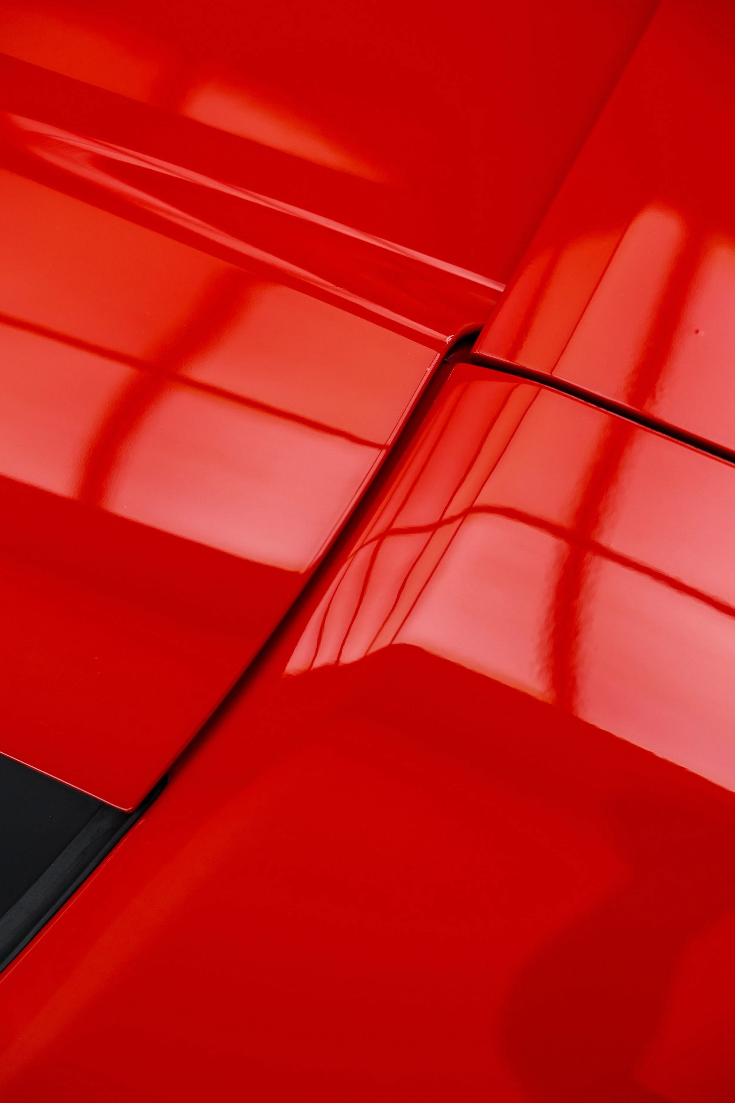 Red Ferrari 296 Speciale bonnet and panel gap close up with XPEL Paint Protection Film in Sydney