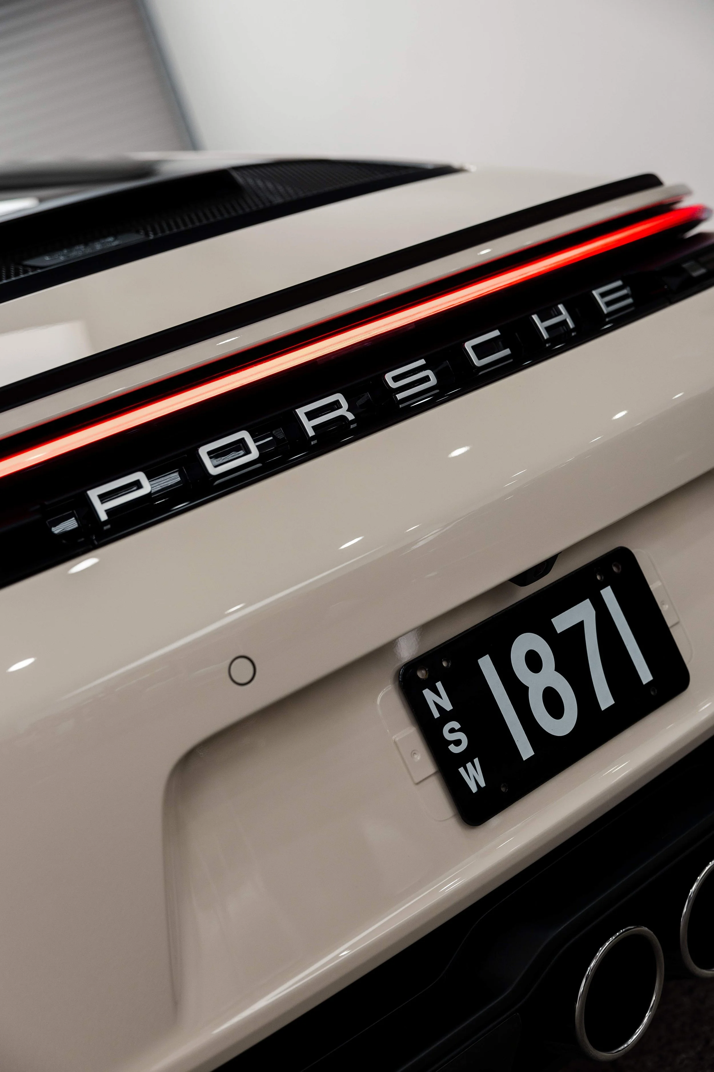 Cream Porsche 911 GT3 Touring Porsche script and number plate detail with XPEL Paint Protection Film in Sydney