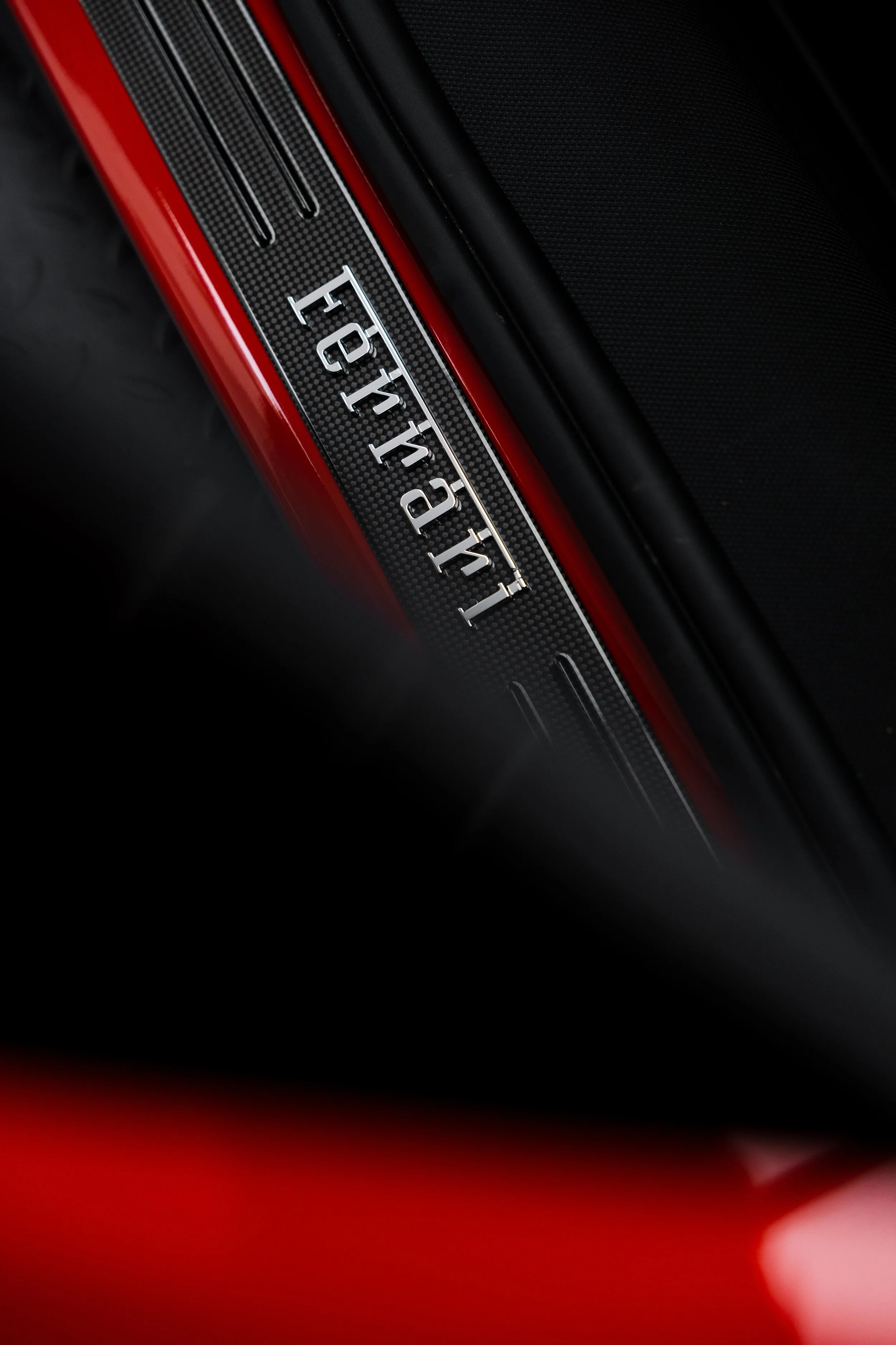 Red Ferrari 296 Speciale interior detailing carbon door sill with Ferrari script in Sydney