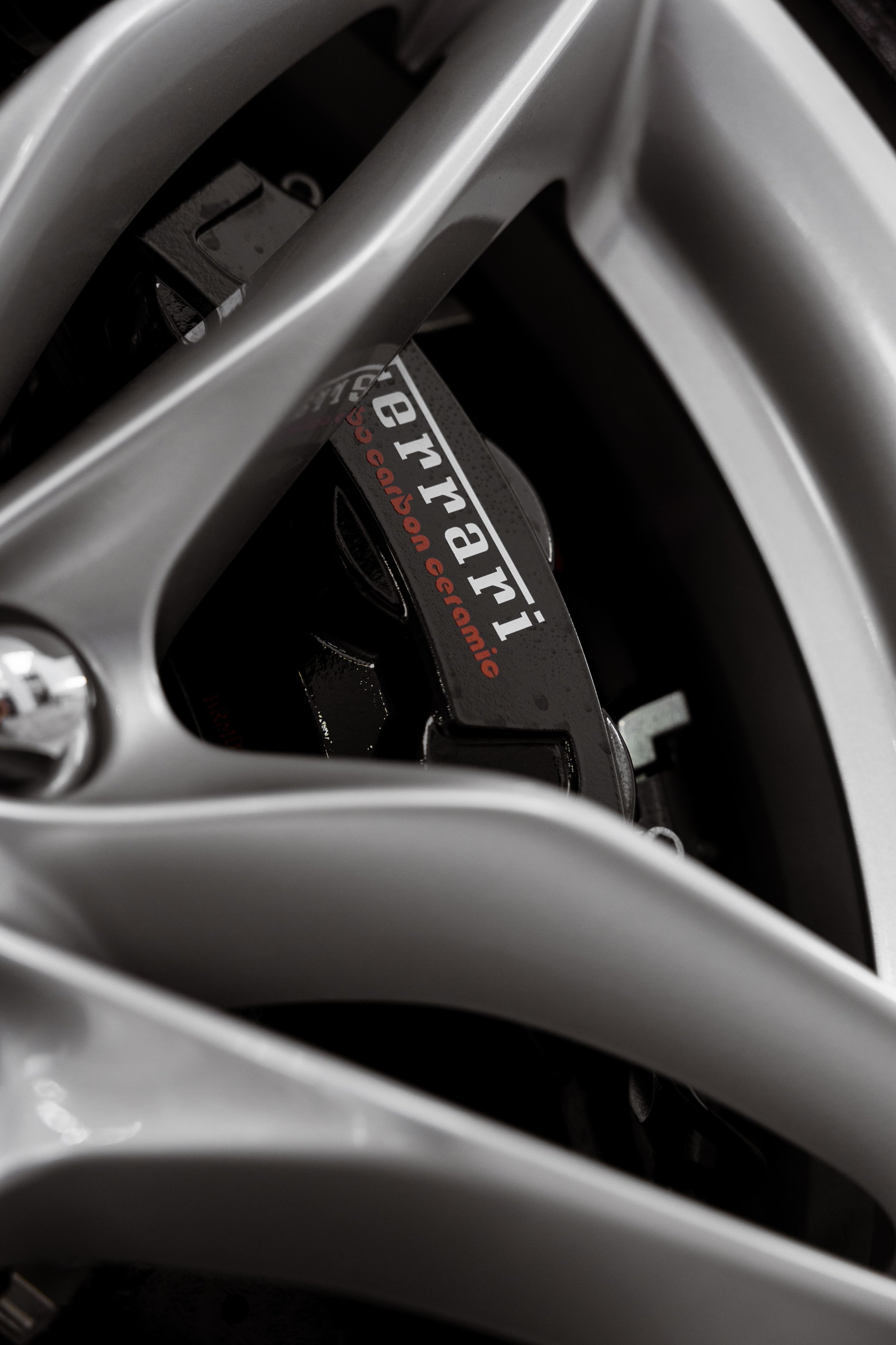 Ferrari 812 GTS brake caliper and alloy wheel detail with ceramic coating and PPF protection by ADS in Sydney