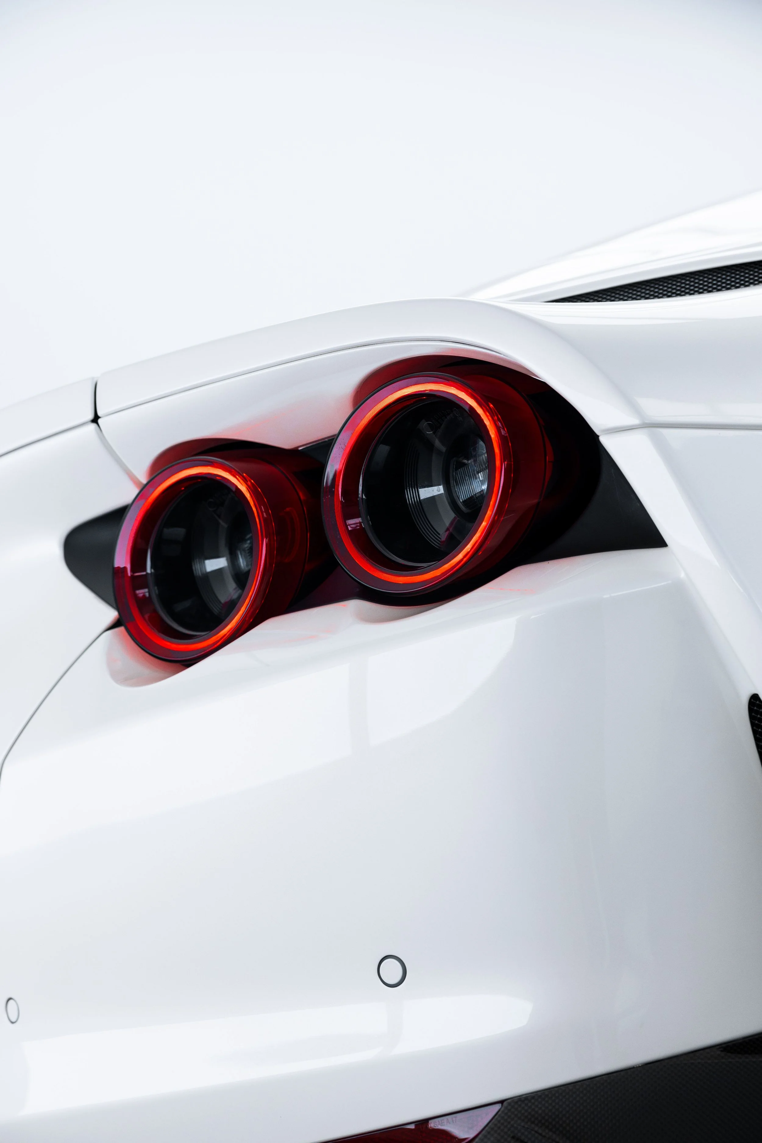 White Ferrari 812 GTS rear taillight detail with XPEL Paint Protection Film in Sydney