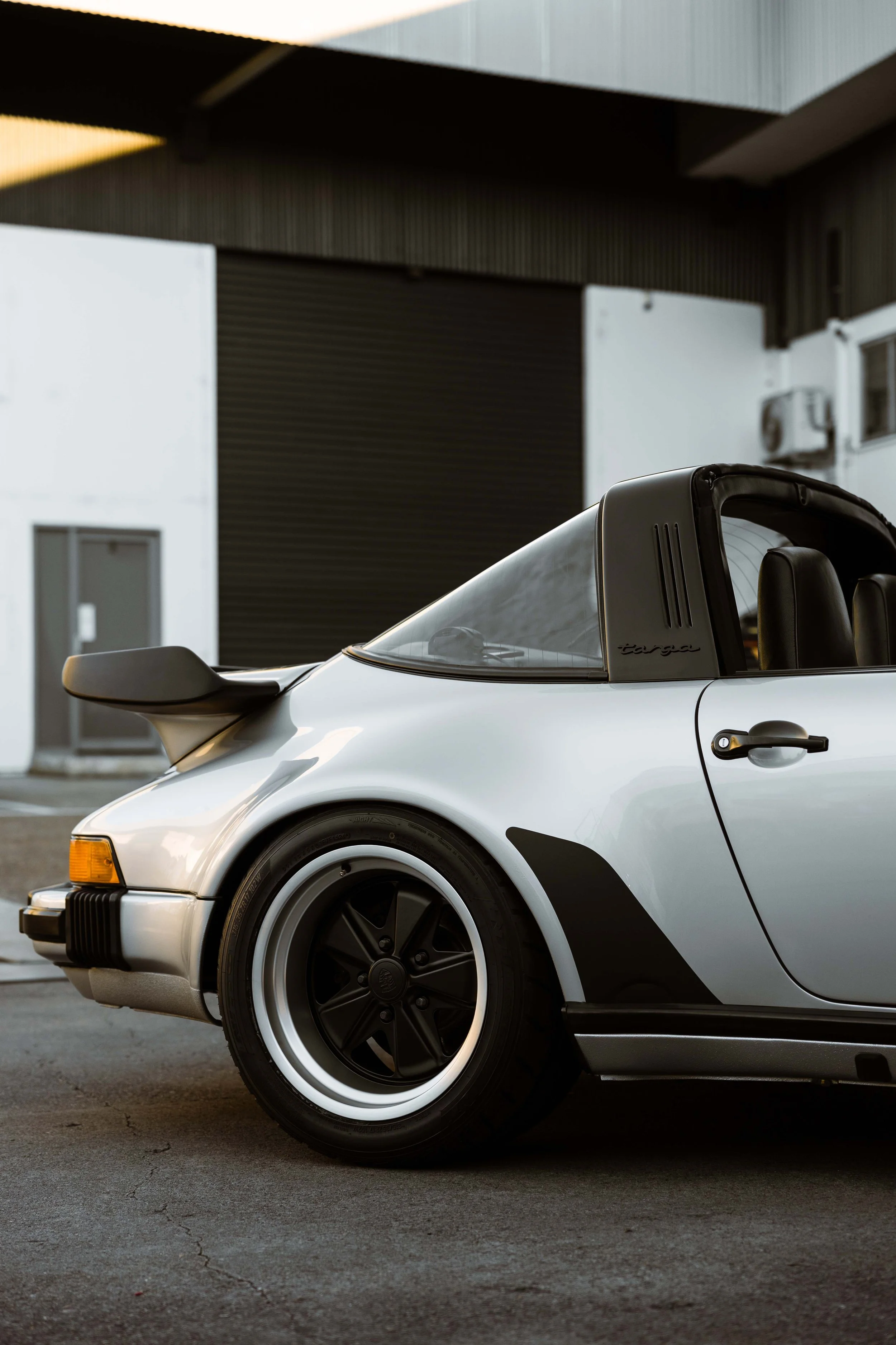 Silver 1989 Porsche 911 Carrera Targa rear quarter and wide body guard in Sydney