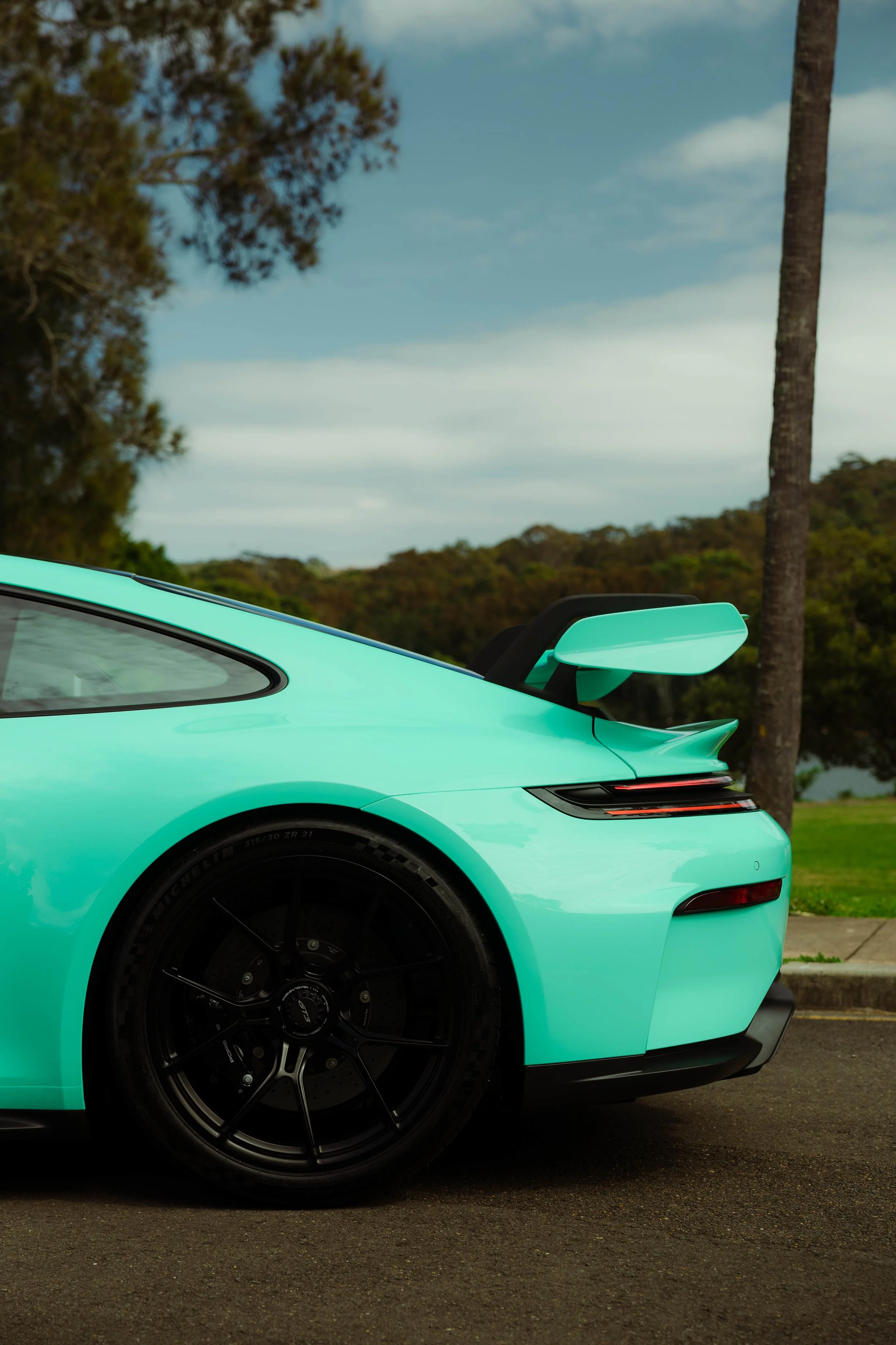 Mint green Porsche 911 GT3 rear quarter and rear wing with XPEL Paint Protection Film in Mona Vale