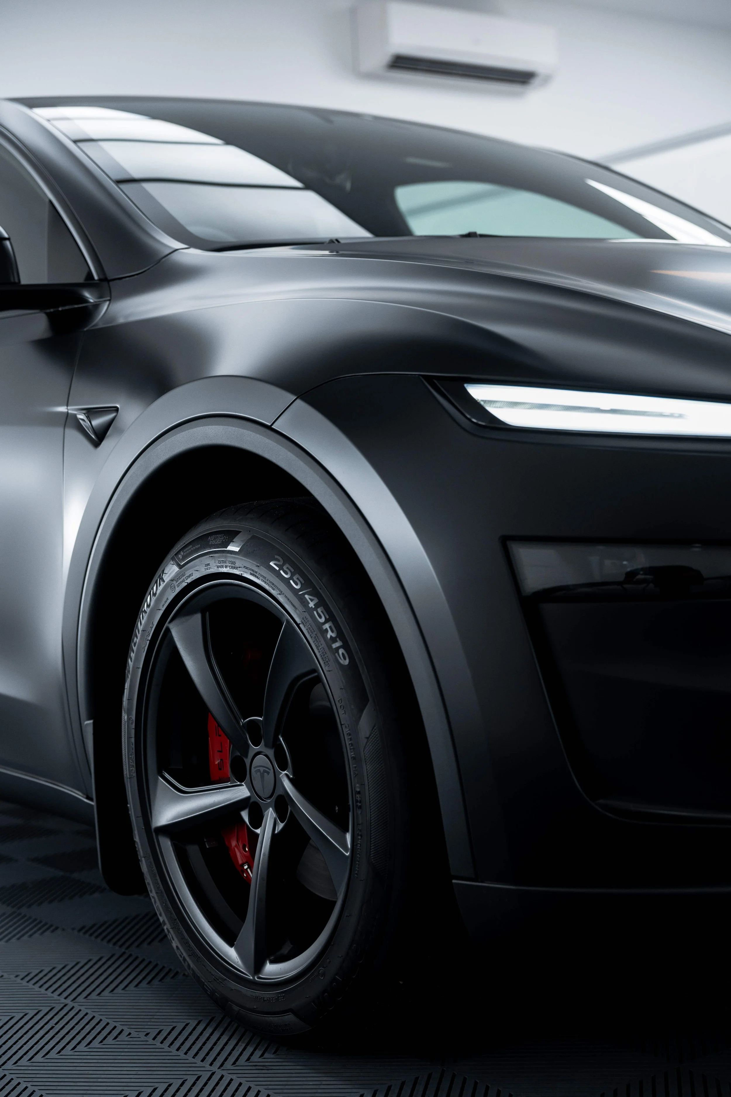 Matte black Tesla Model Y front quarter and wheel arch with XPEL Stealth Paint Protection Film in Sydney