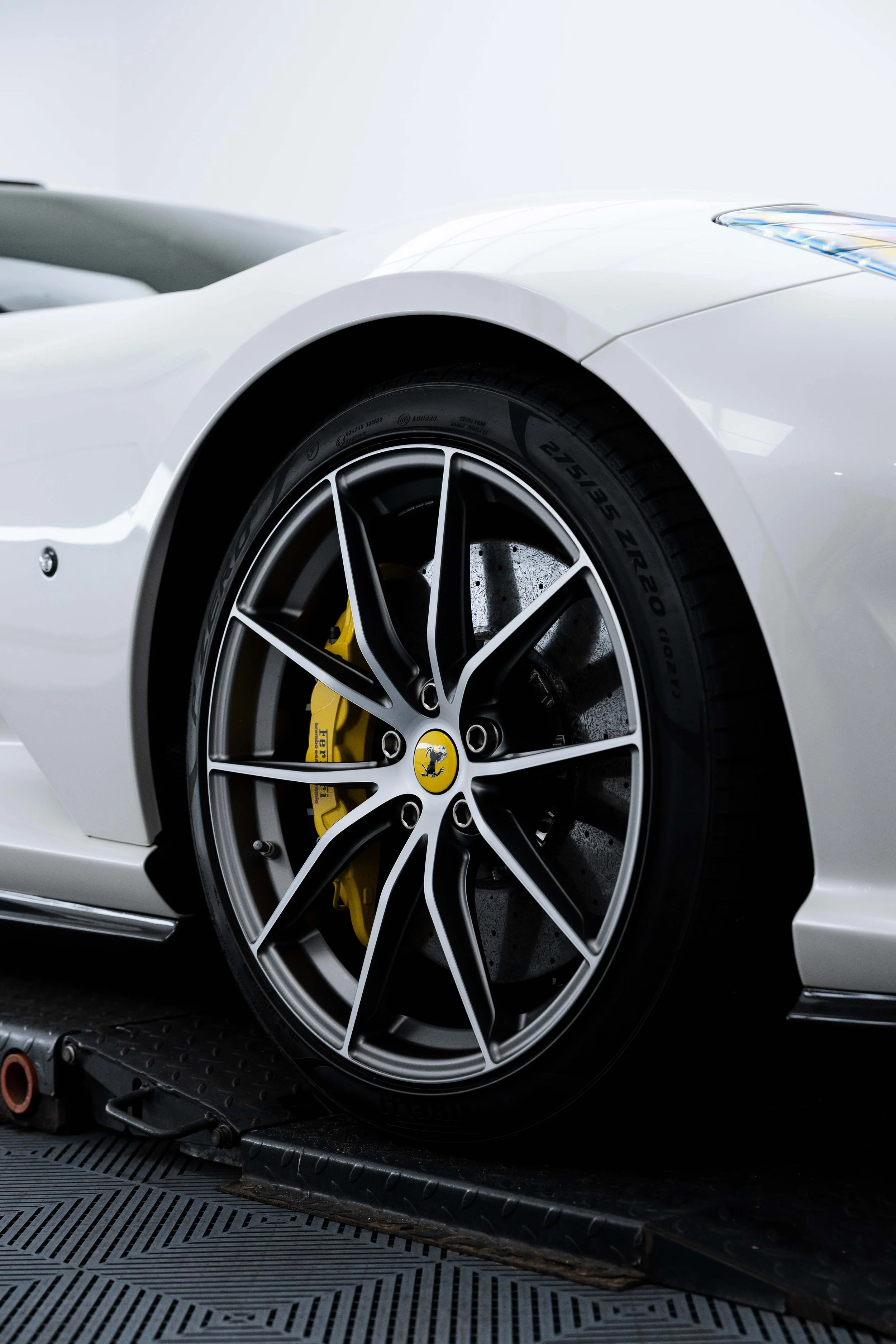 White Ferrari 812 GTS wheel and yellow brake caliper with XPEL Paint Protection Film in Sydney