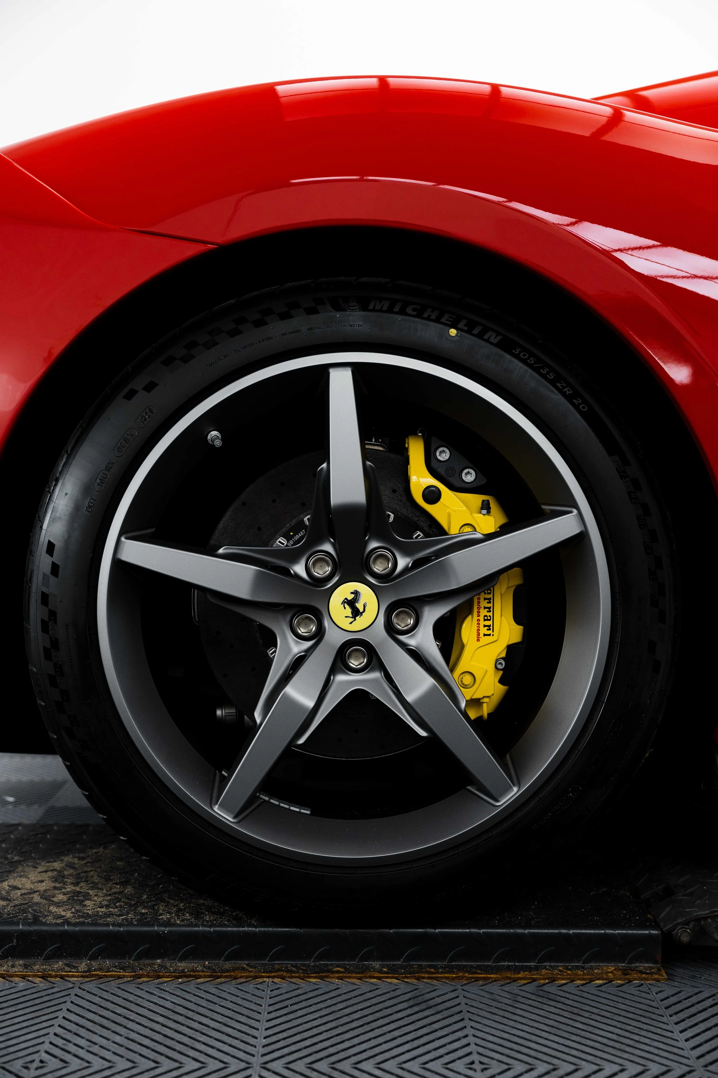 Red Ferrari 296 Speciale wheel and yellow brake caliper in Sydney