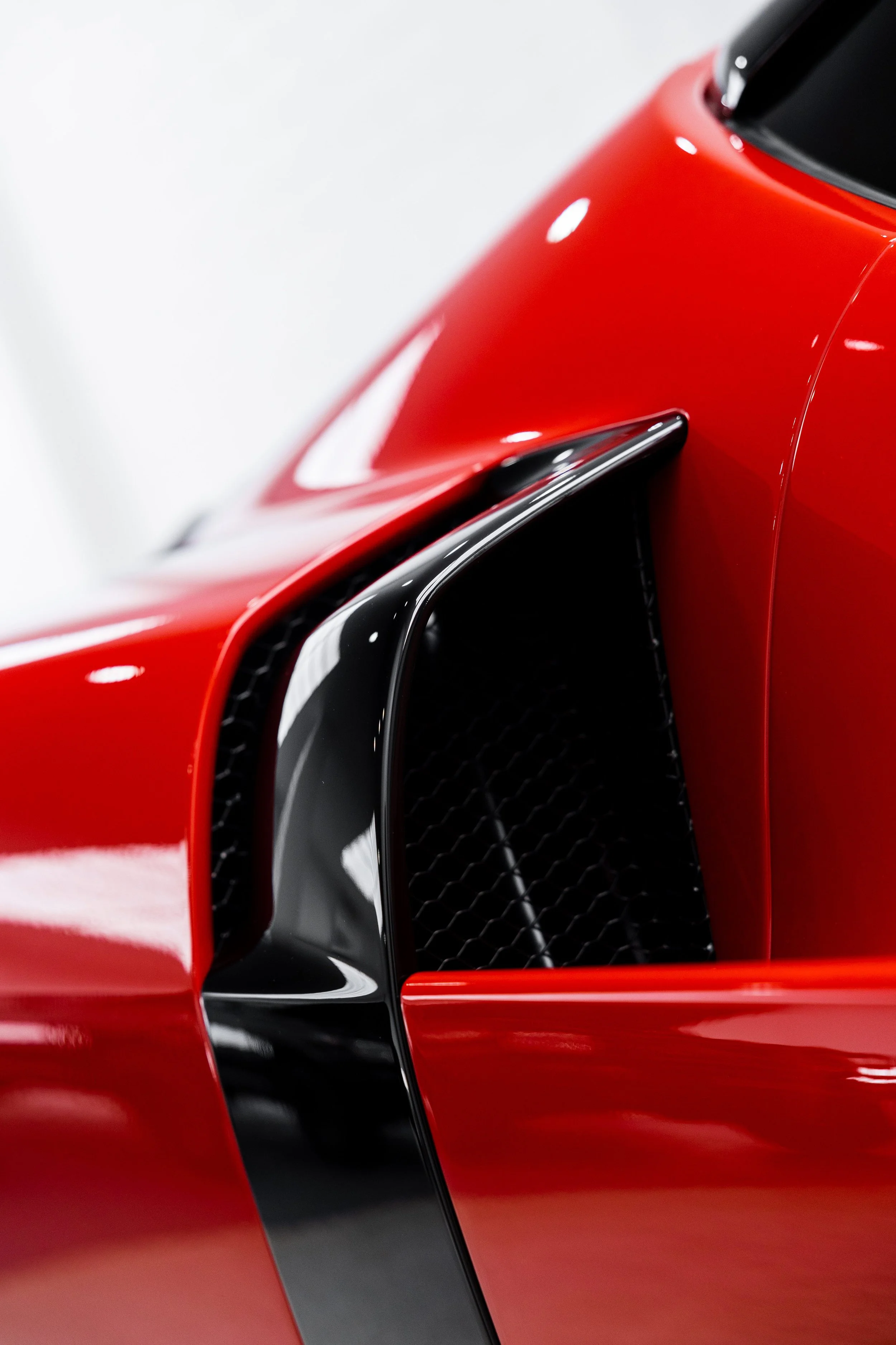 Red Ferrari 849 Testarossa side vent with XPEL Paint Protection Film in Mona Vale