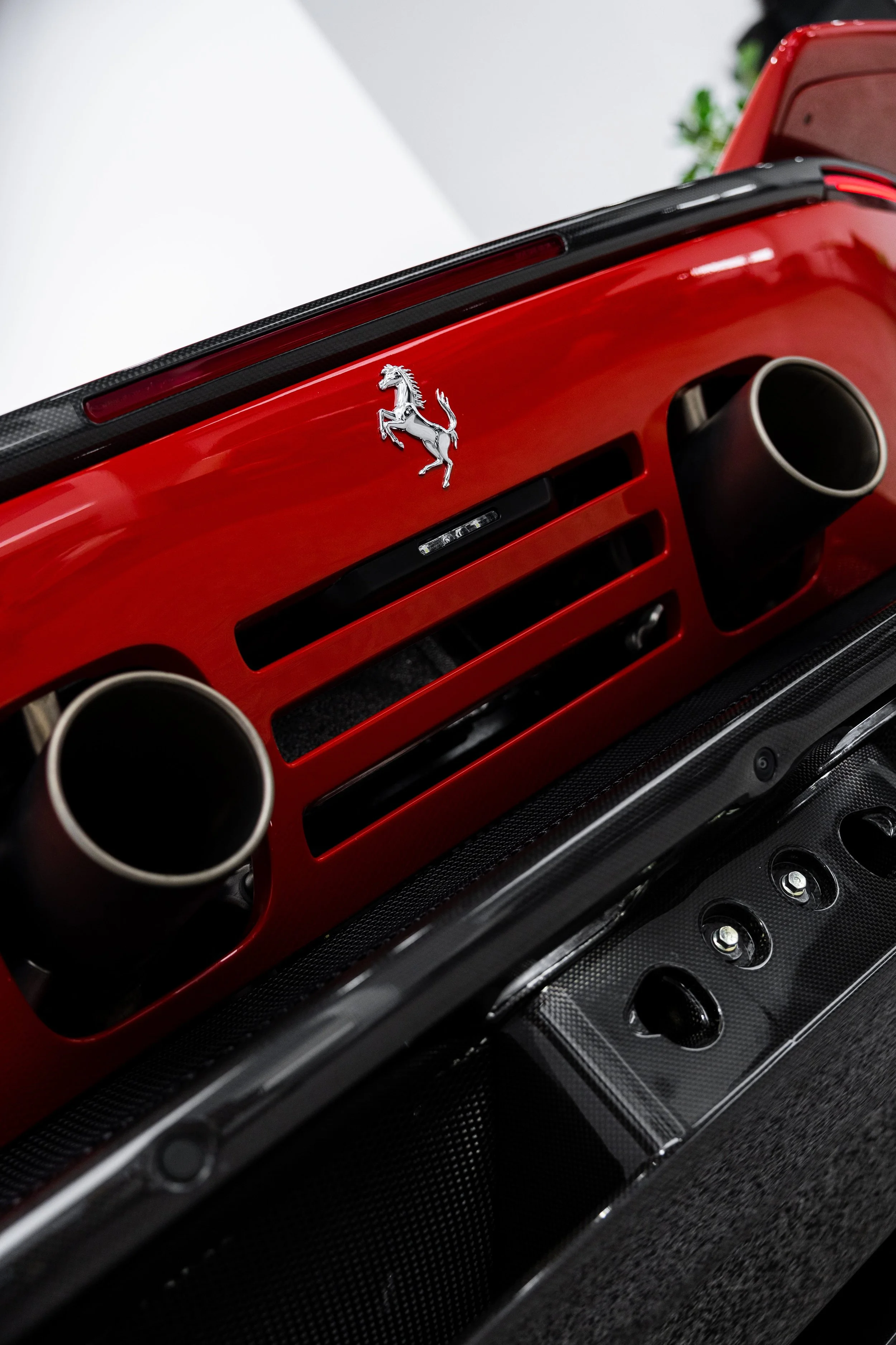 Prancing horse badge and exhaust on red Ferrari 849 Testarossa with XPEL Paint Protection Film in Sydney