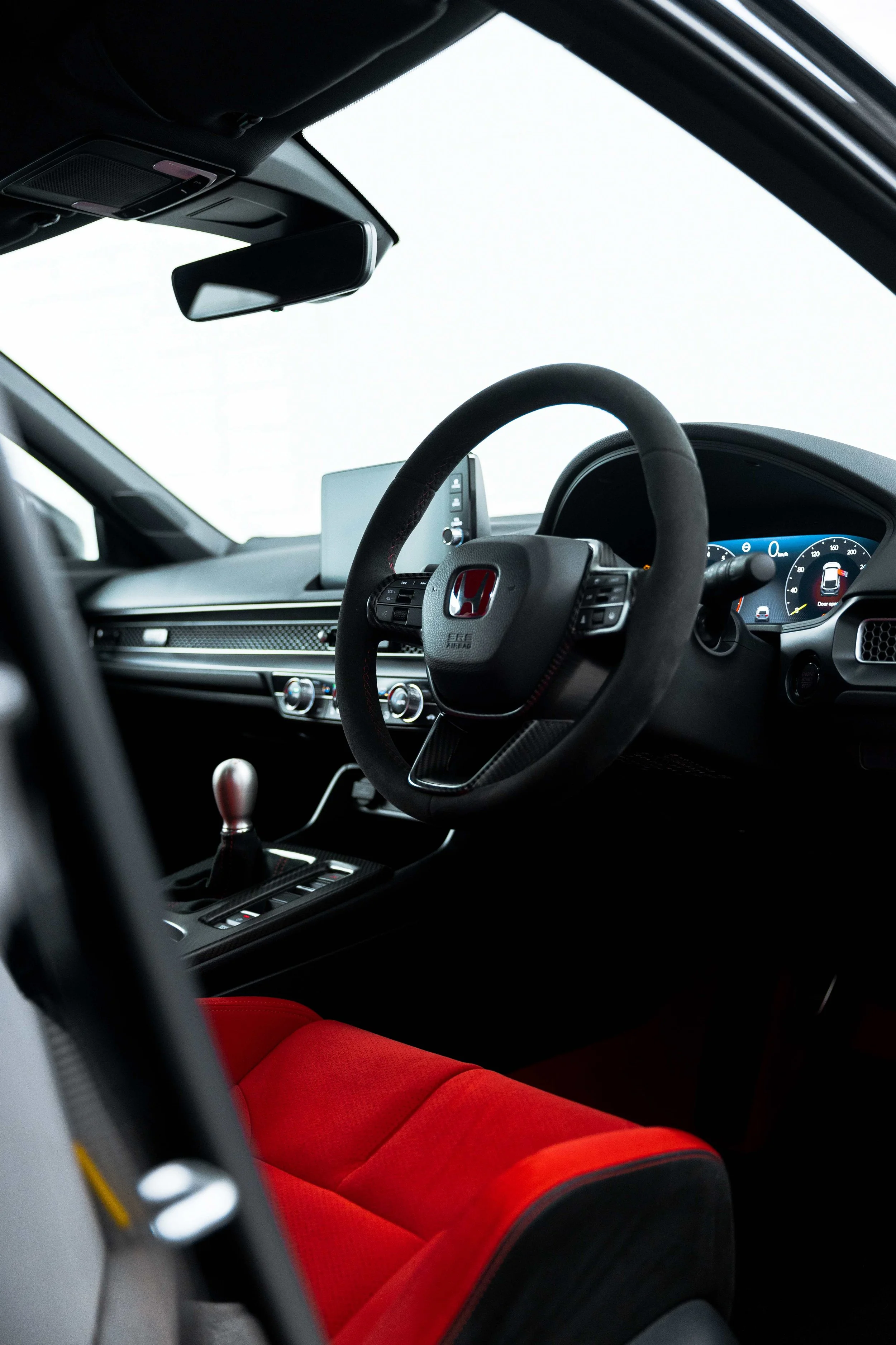 Honda Civic Type R steering wheel and red racing seat after interior detailing in Mona Vale