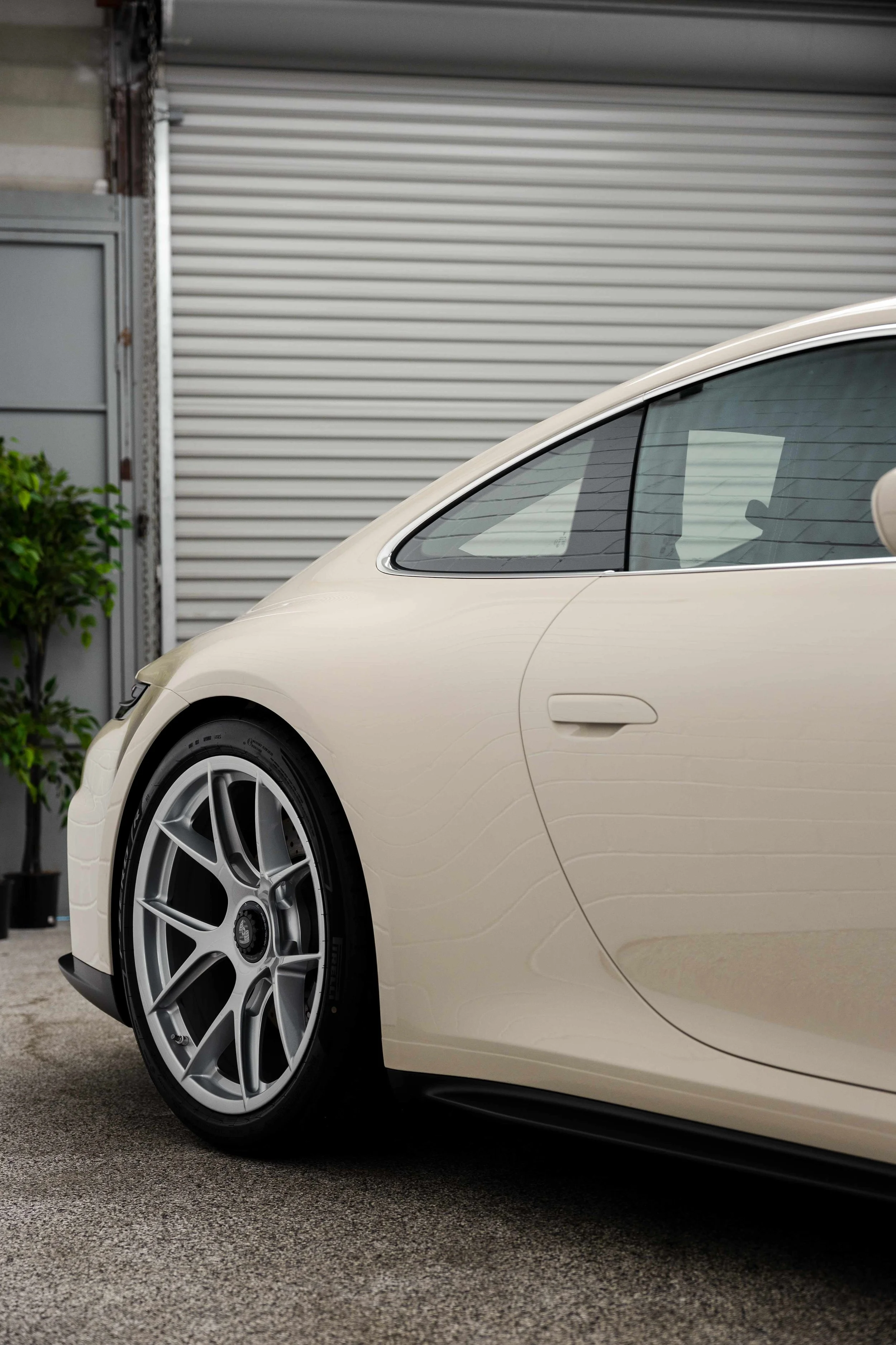 Cream Porsche 911 GT3 Touring front wheel and side skirt with XPEL Paint Protection Film in Mona Vale