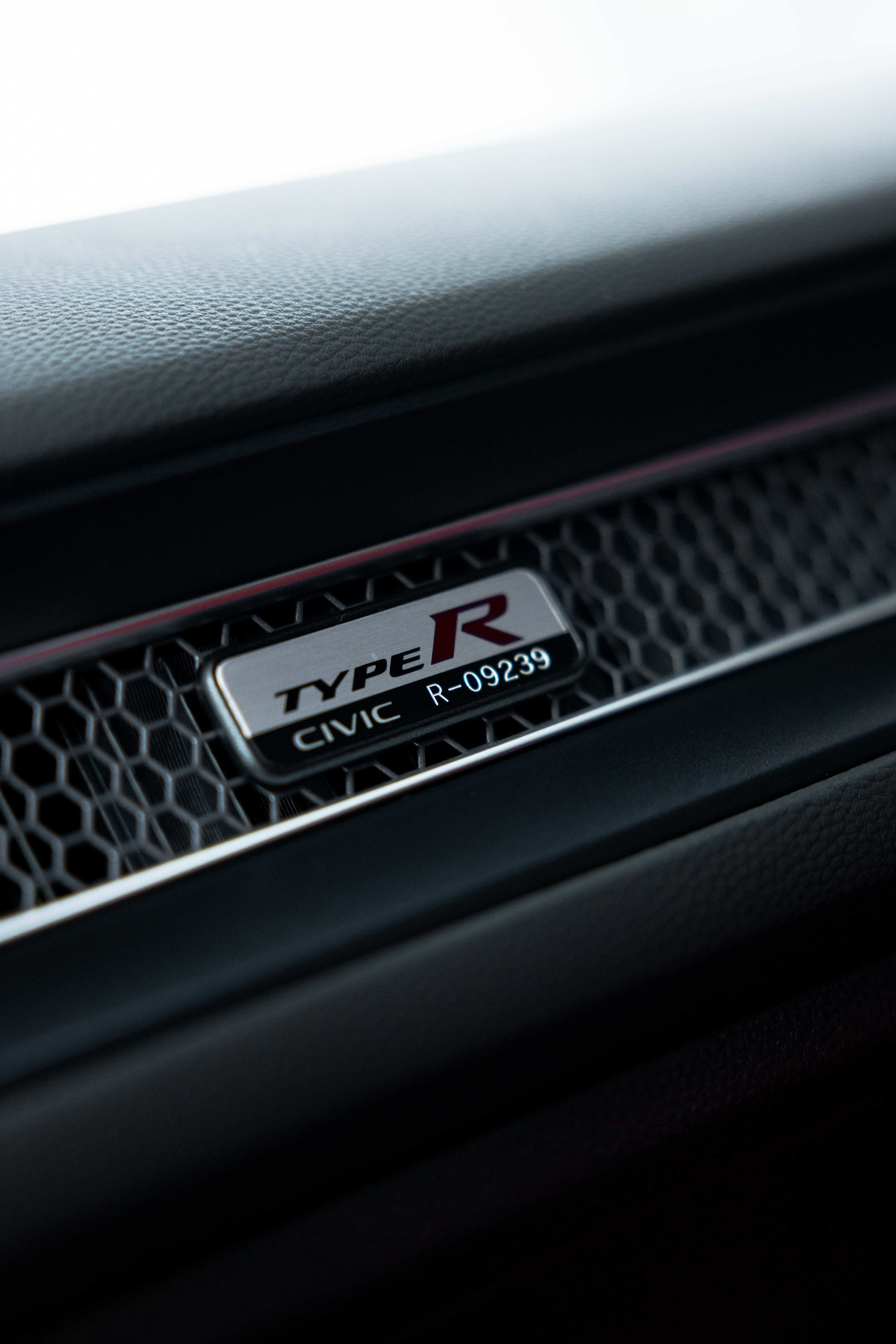 Civic Type R badge on door trim after interior detailing in Sydney