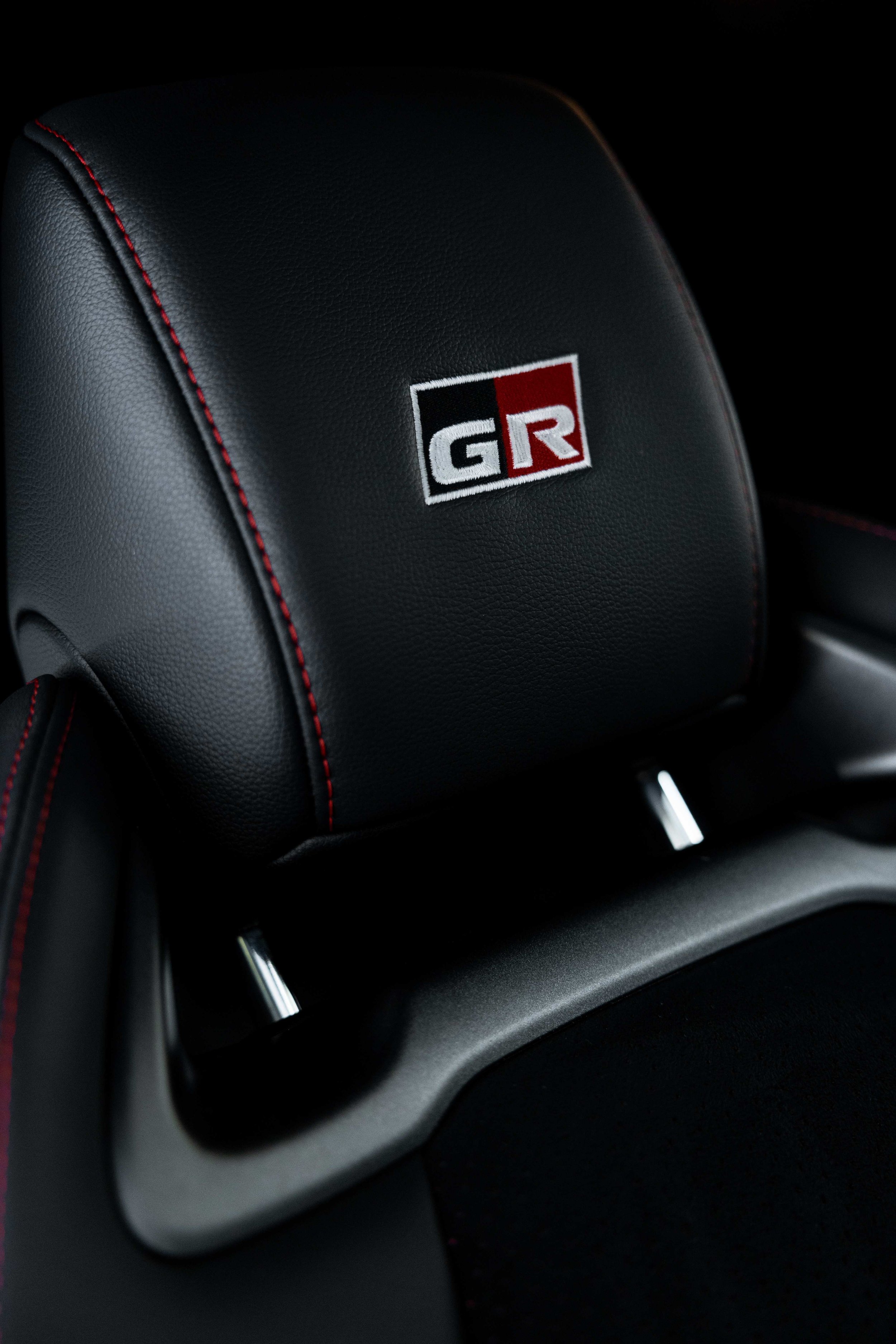 Matte grey Toyota GR Yaris interior detailing seat headrest GR badge close up in Sydney