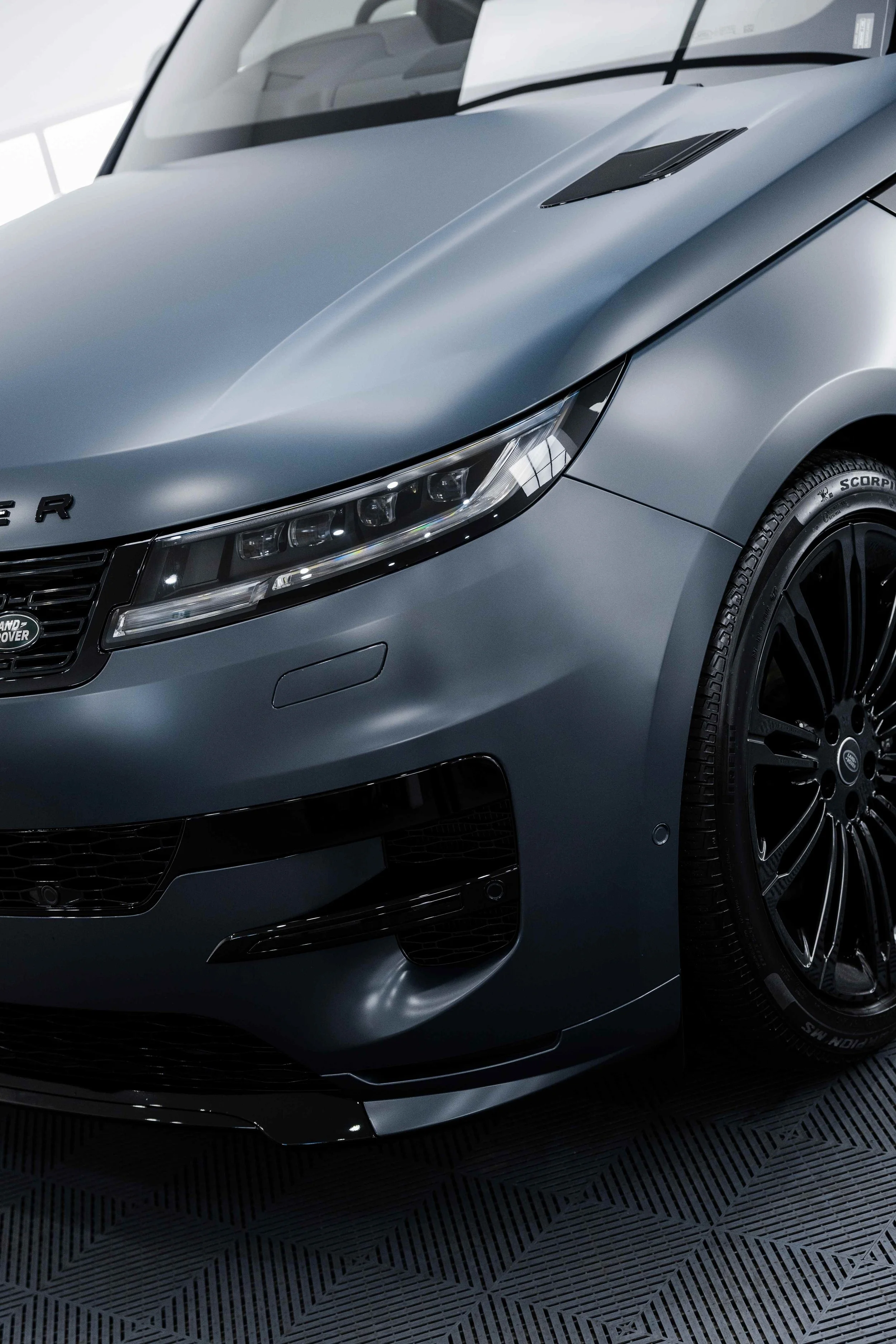 Matte grey Range Rover Sport front end and headlight with XPEL Stealth Paint Protection Film in Sydney