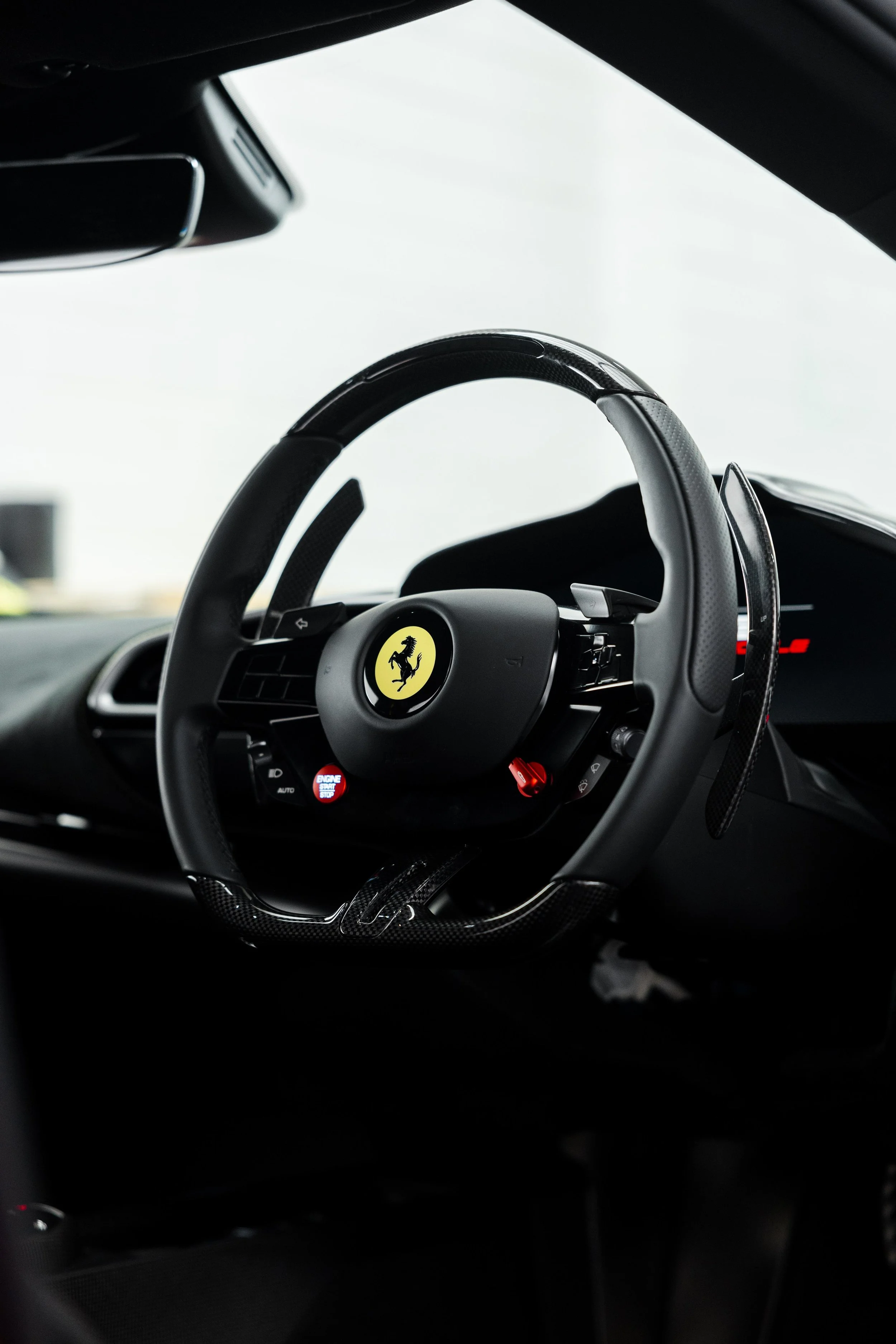 Red Ferrari 296 Speciale interior detailing carbon fibre steering wheel in Mona Vale