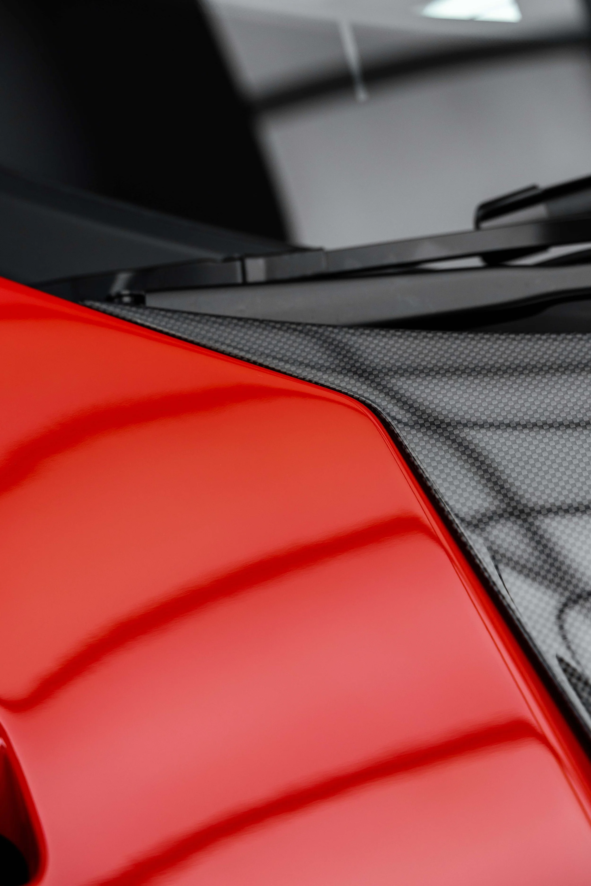 Red Ferrari 296 Speciale windscreen base and carbon cowl detail with XPEL Paint Protection Film in Sydney