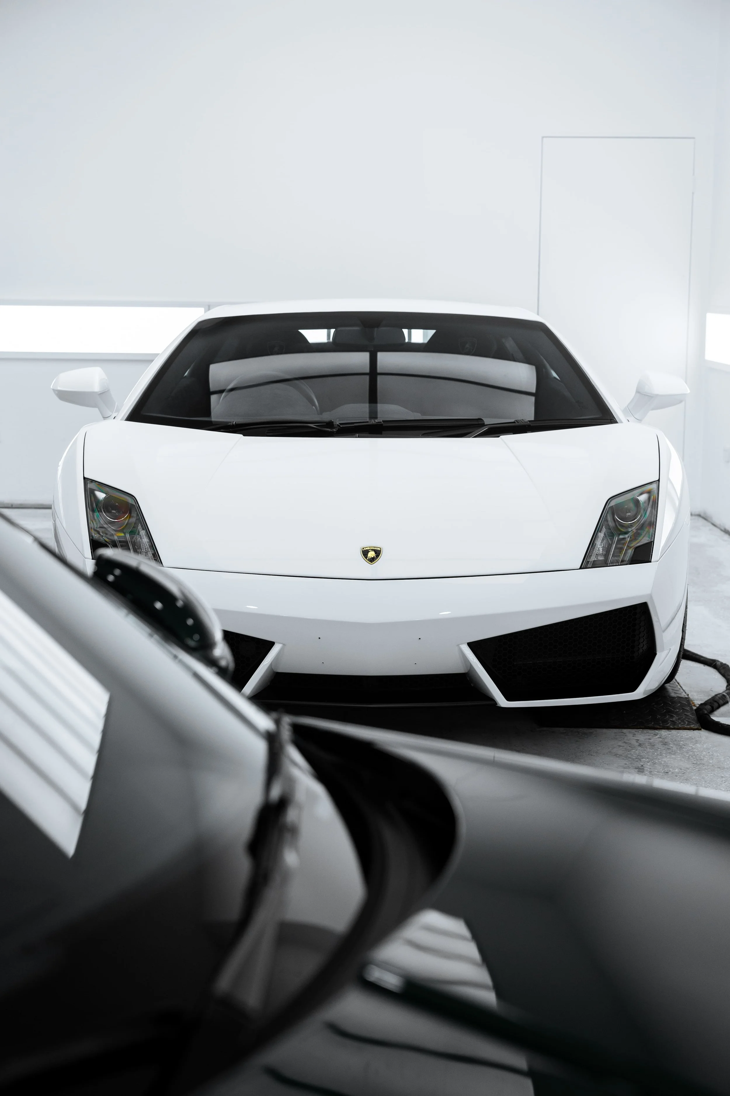 White Lamborghini Gallardo front view in studio with full PPF by ADS in Mona Vale