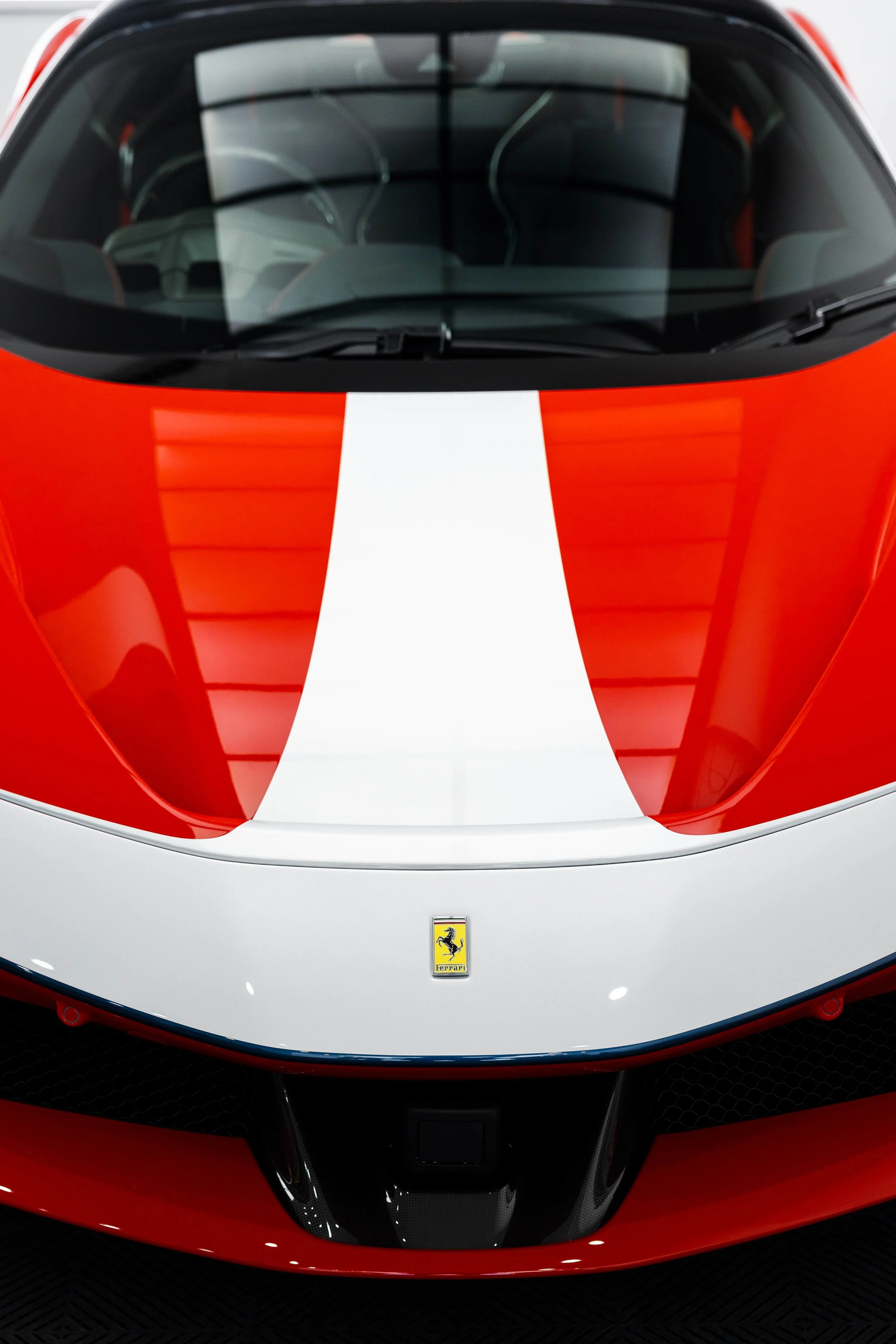 Red Ferrari SF90 Spyder bonnet, white stripe and Prancing Horse badge with XPEL Paint Protection Film in Sydney
