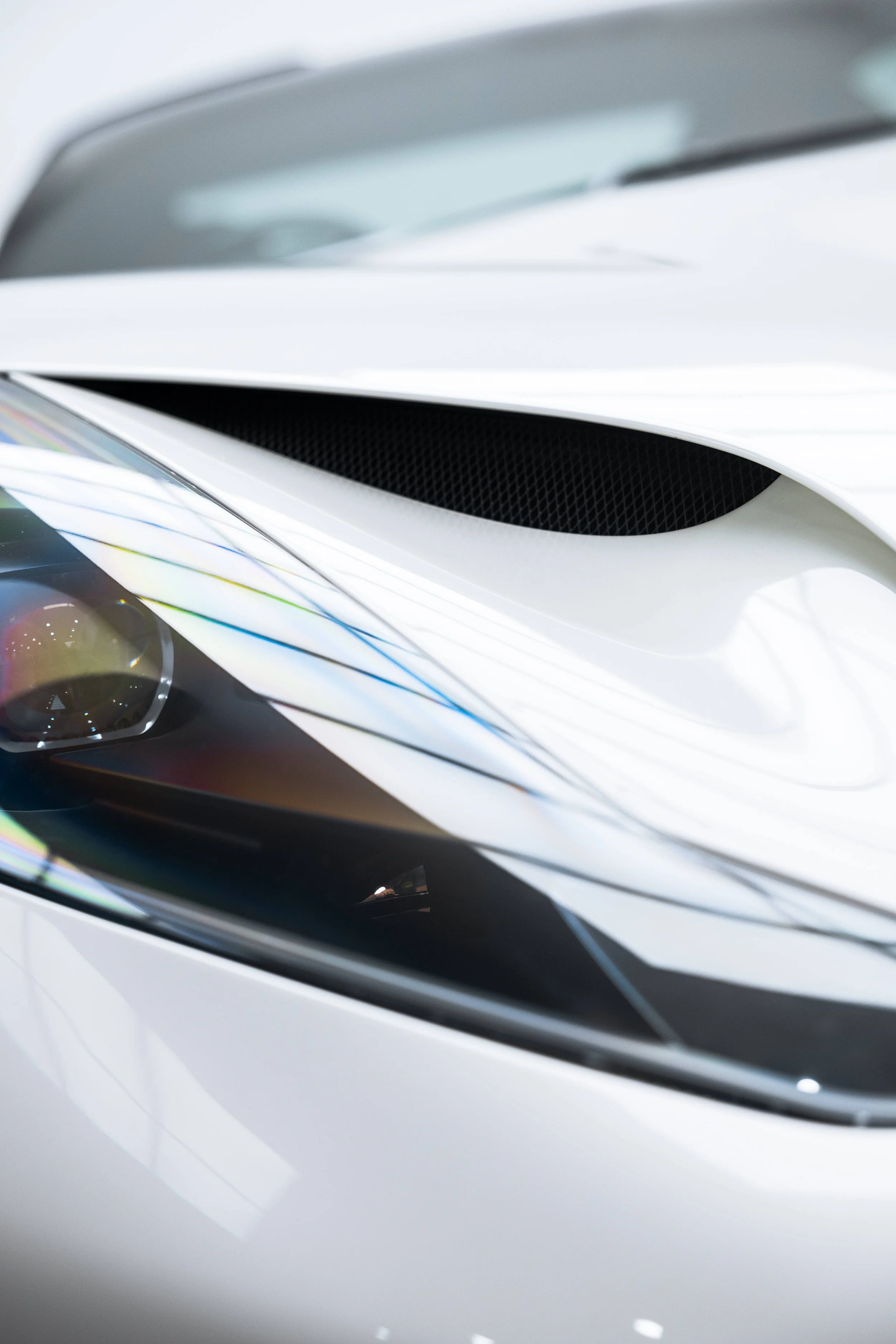 White Ferrari 812 GTS windscreen and headlight edge with XPEL Paint Protection Film in Mona Vale