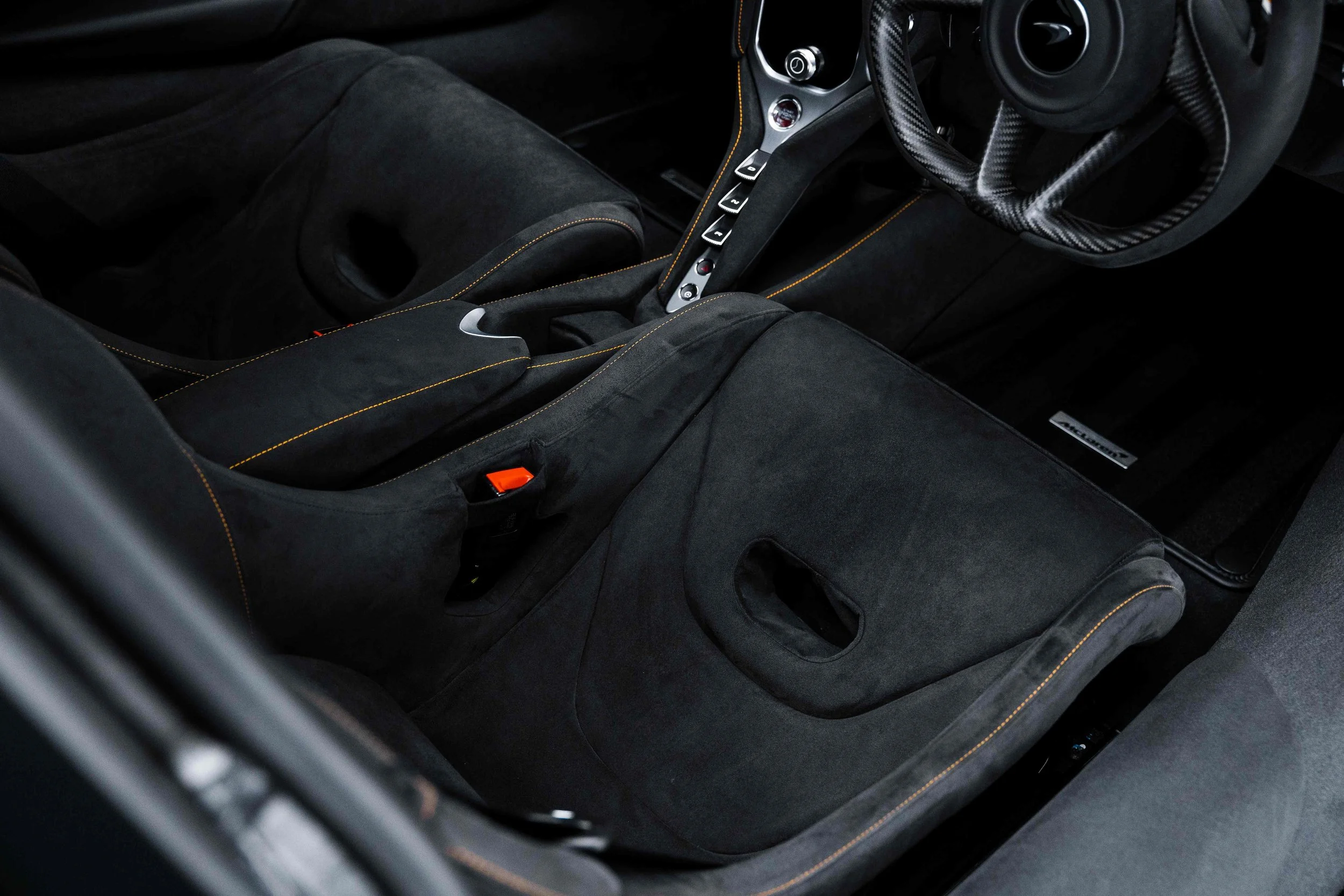 Black McLaren 750S interior detailing carbon fibre seats and gear shifter in Sydney