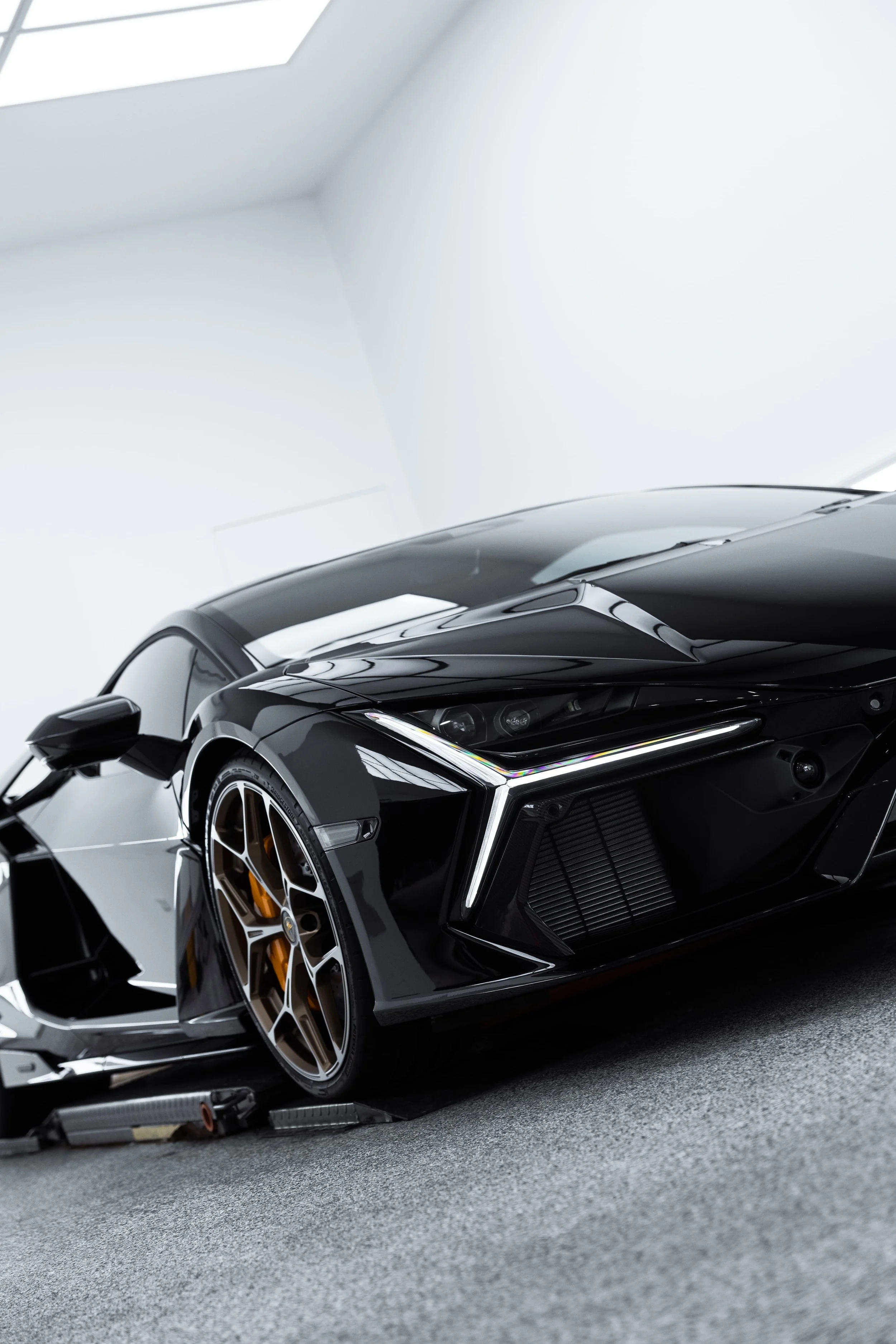 Front angle of black Lamborghini Revuelto with PPF protection and detailing by ADS in Sydney