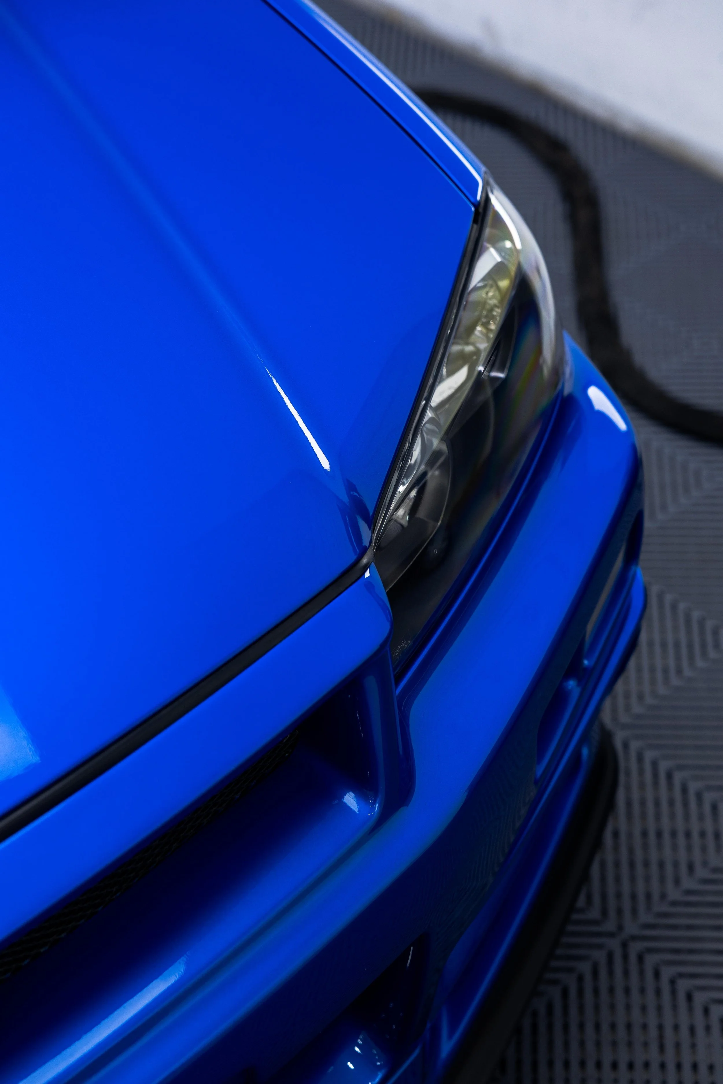 Bayside blue Nissan R34 GT-R Nur bonnet and headlight with XPEL Paint Protection Film in Sydney