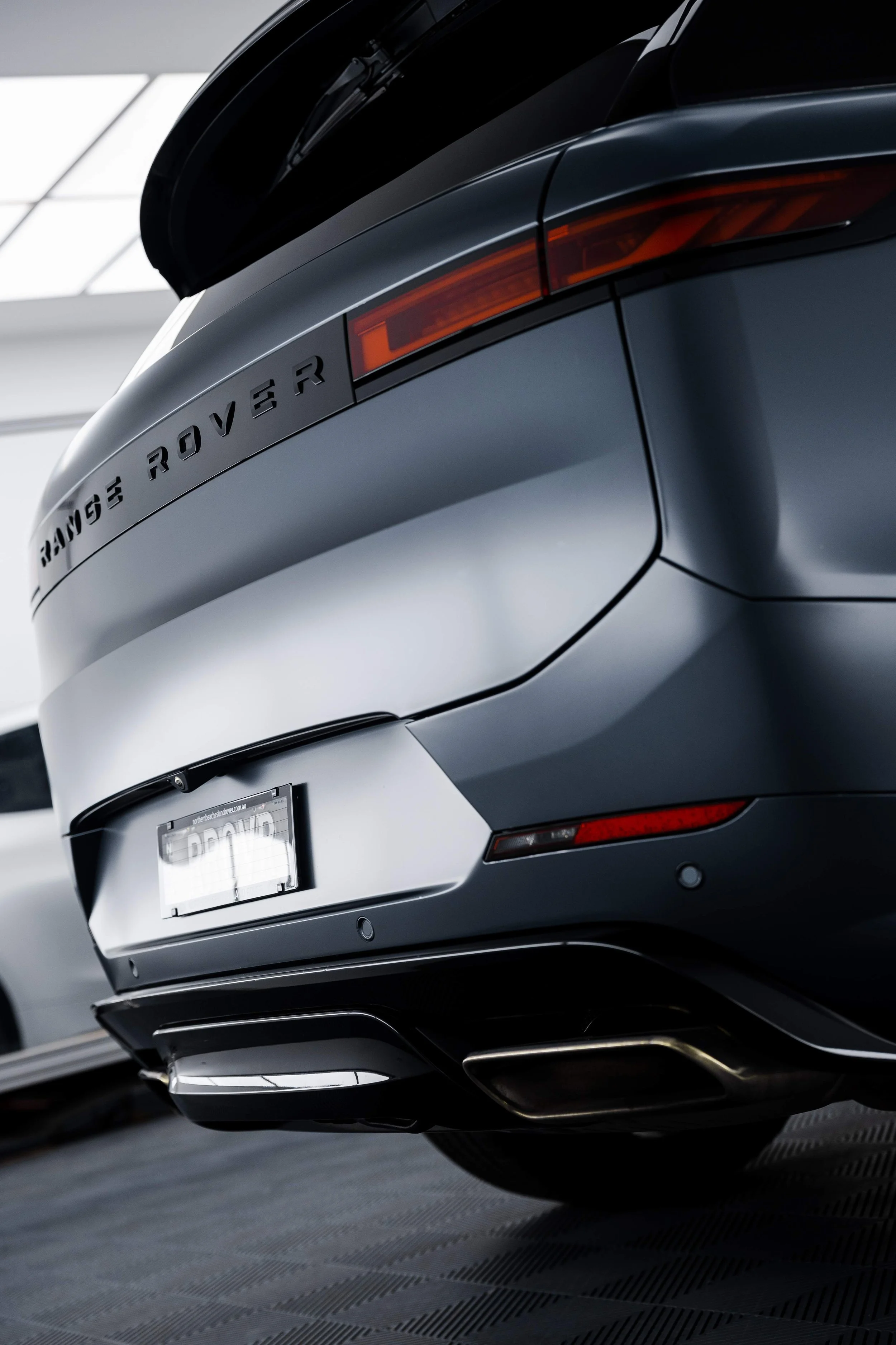 Matte grey Range Rover Sport rear bumper with XPEL Stealth Paint Protection Film in Mona Vale