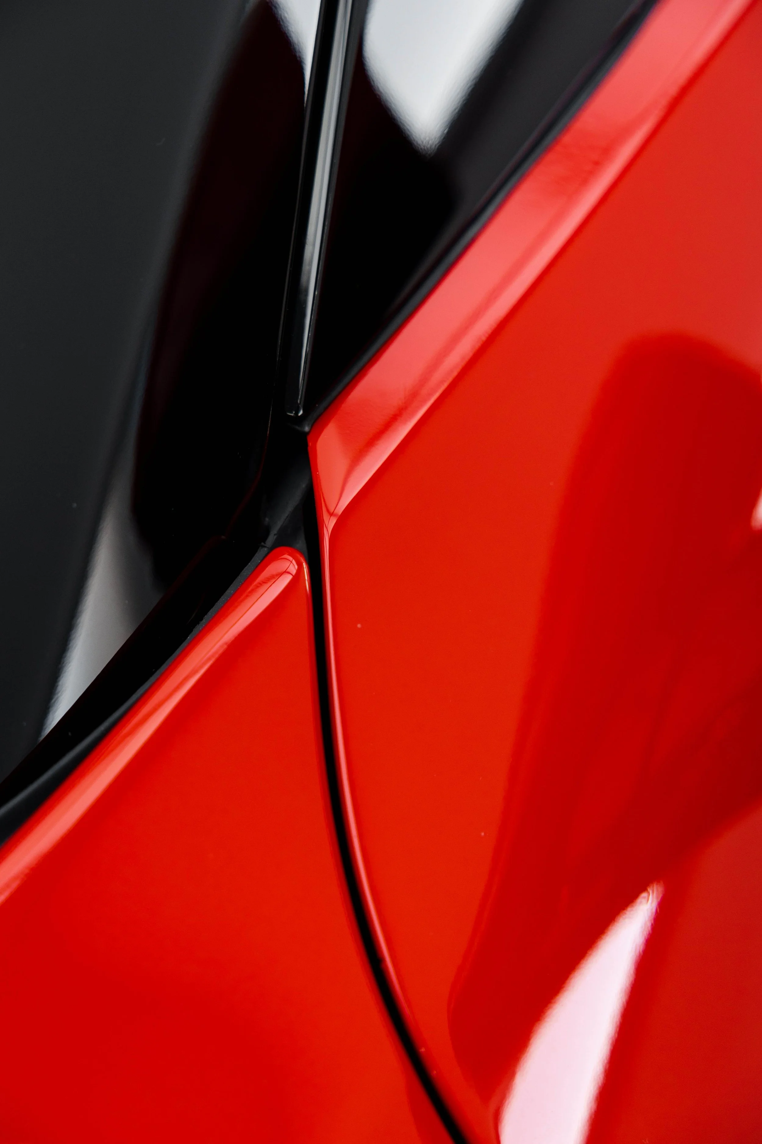 Red Ferrari 296 Speciale A pillar and door panel detail with XPEL Paint Protection Film in Sydney