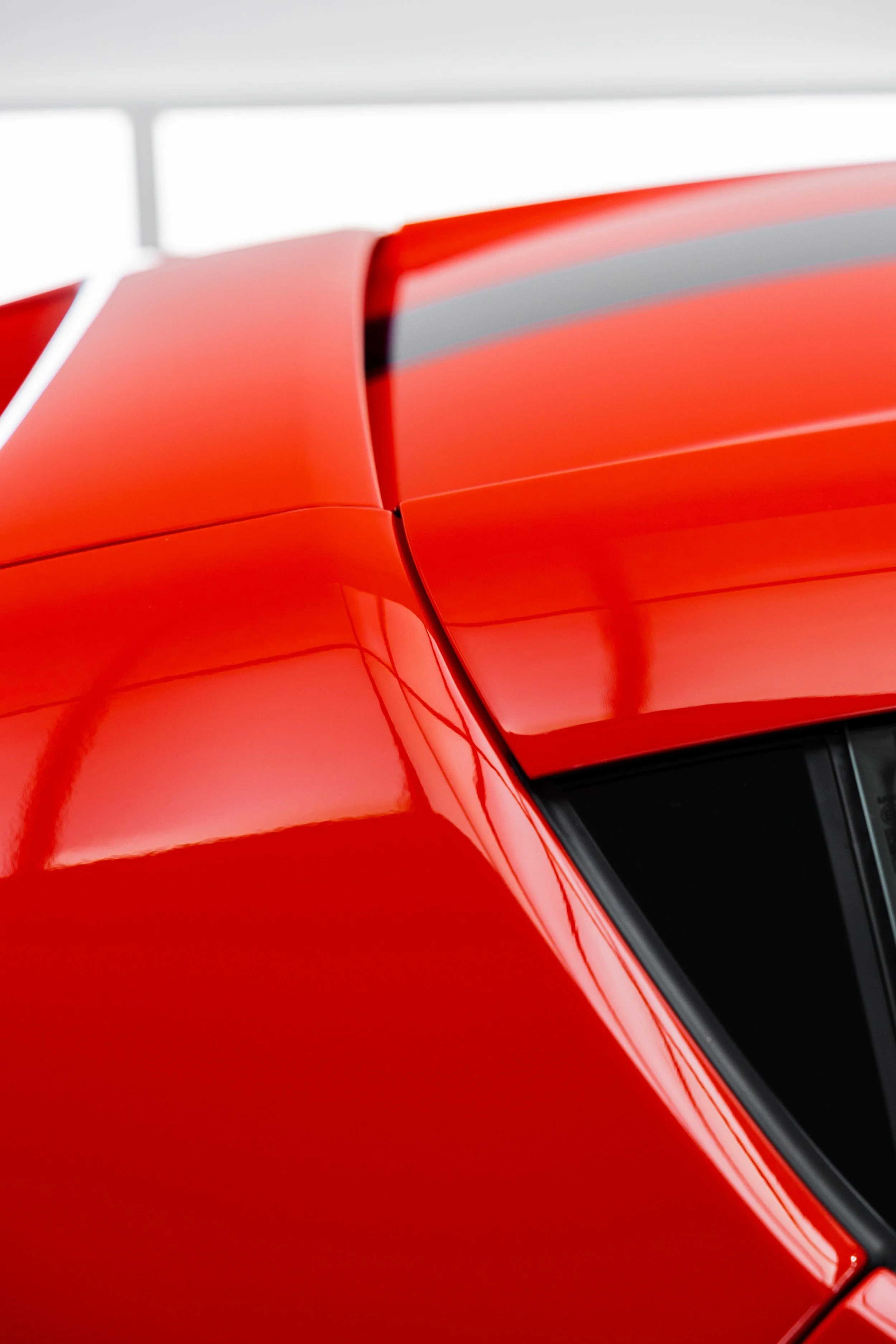 Red Ferrari 296 Speciale rear quarter window and roofline with XPEL Paint Protection Film in Mona Vale