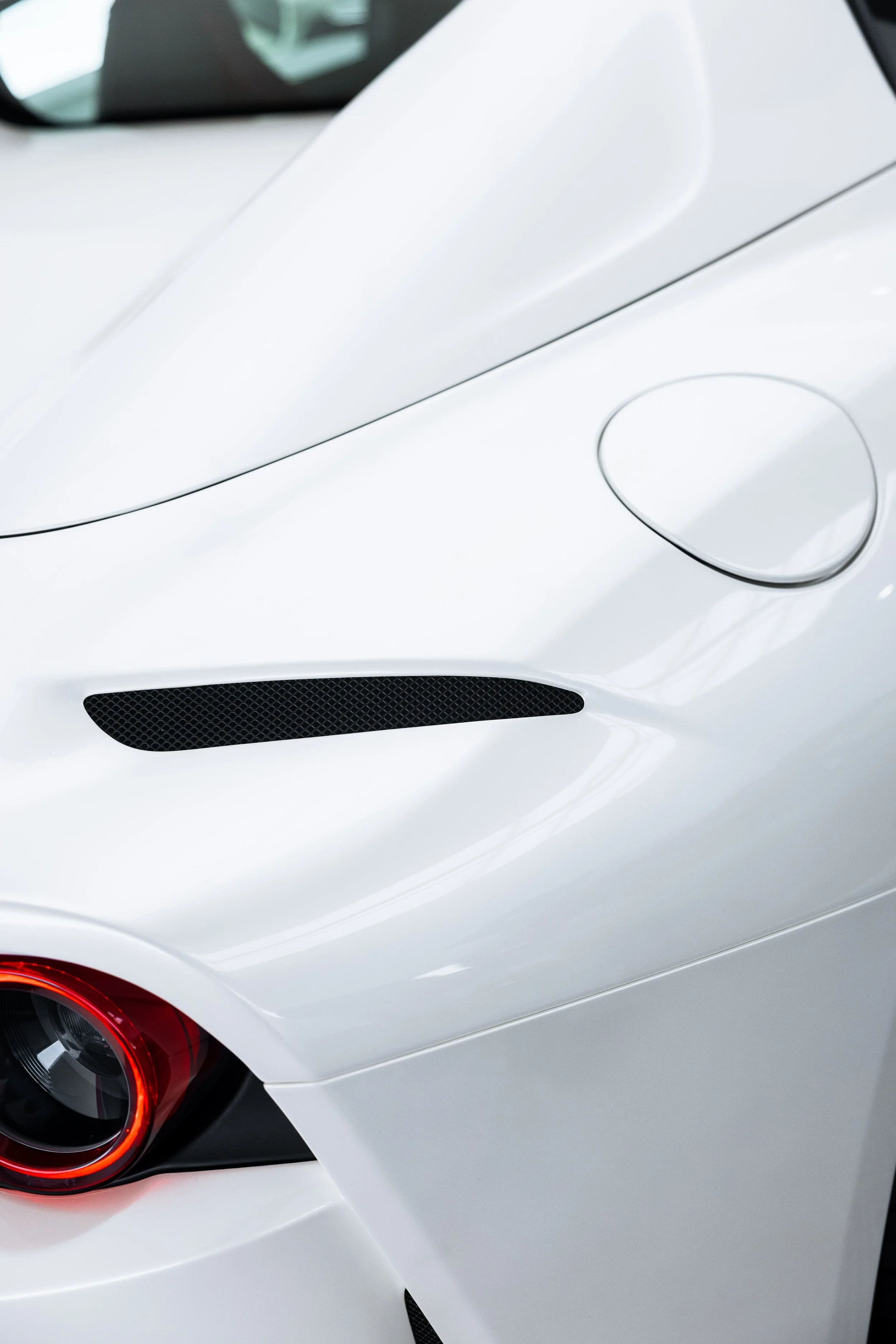 White Ferrari 812 GTS fuel filler cap and side vent with XPEL Paint Protection Film in Mona Vale