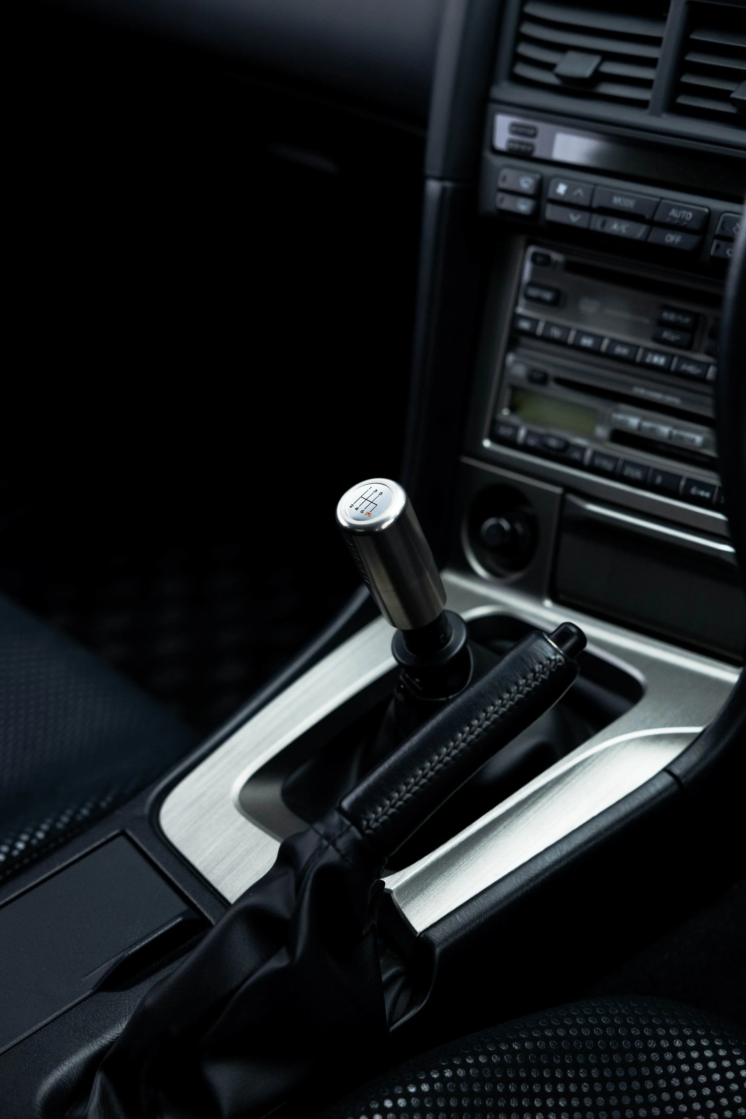 Nissan R34 GT-R gear shifter and centre console after interior detailing in Sydney