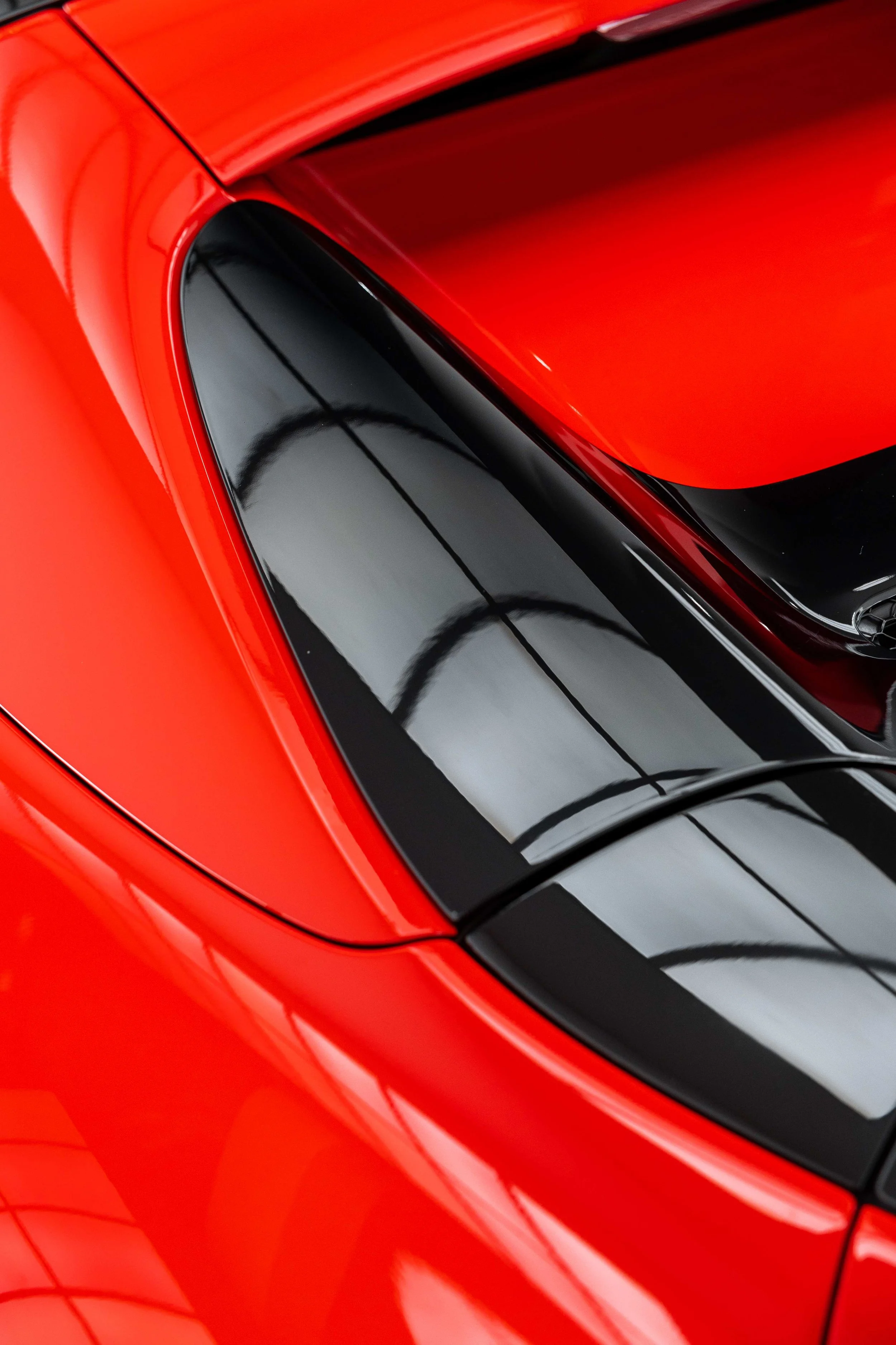 Red Ferrari 296 GTS roofline and targa panel with XPEL Paint Protection Film in Sydney