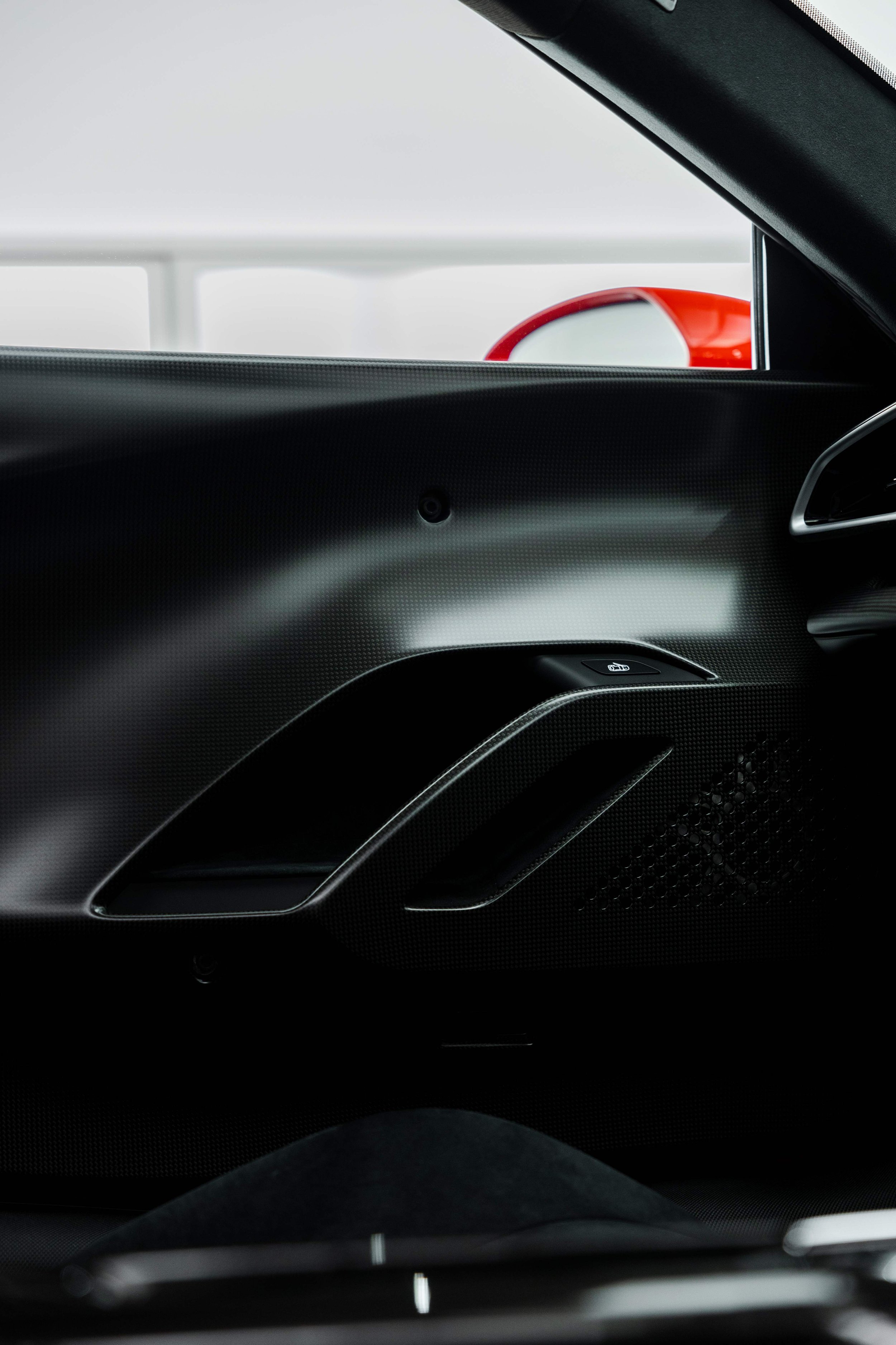 Red Ferrari 296 Speciale interior detailing door card and carbon fibre door pull in Sydney