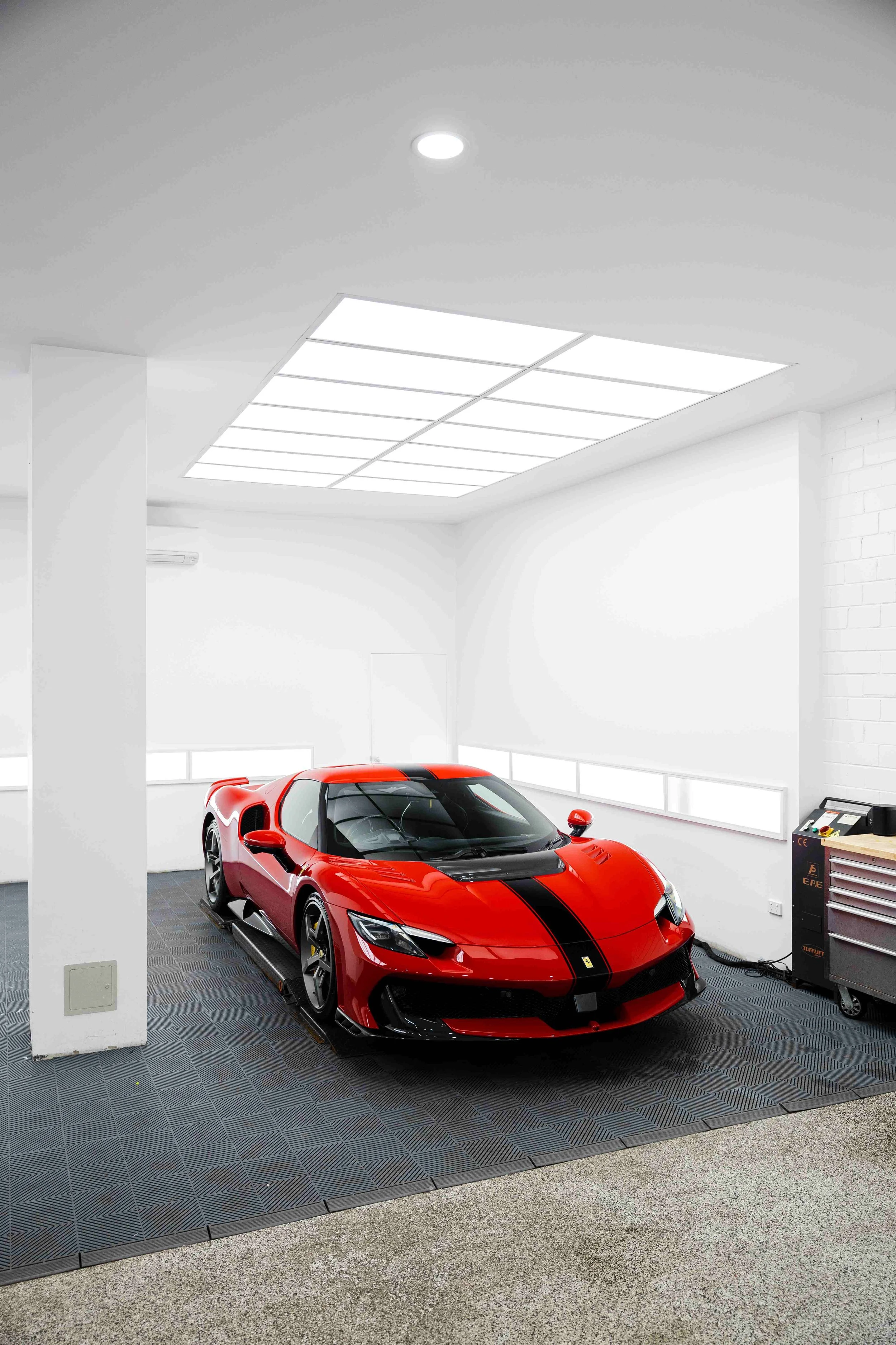 Red Ferrari 296 Speciale wide front three quarter in studio with XPEL Paint Protection Film in Sydney