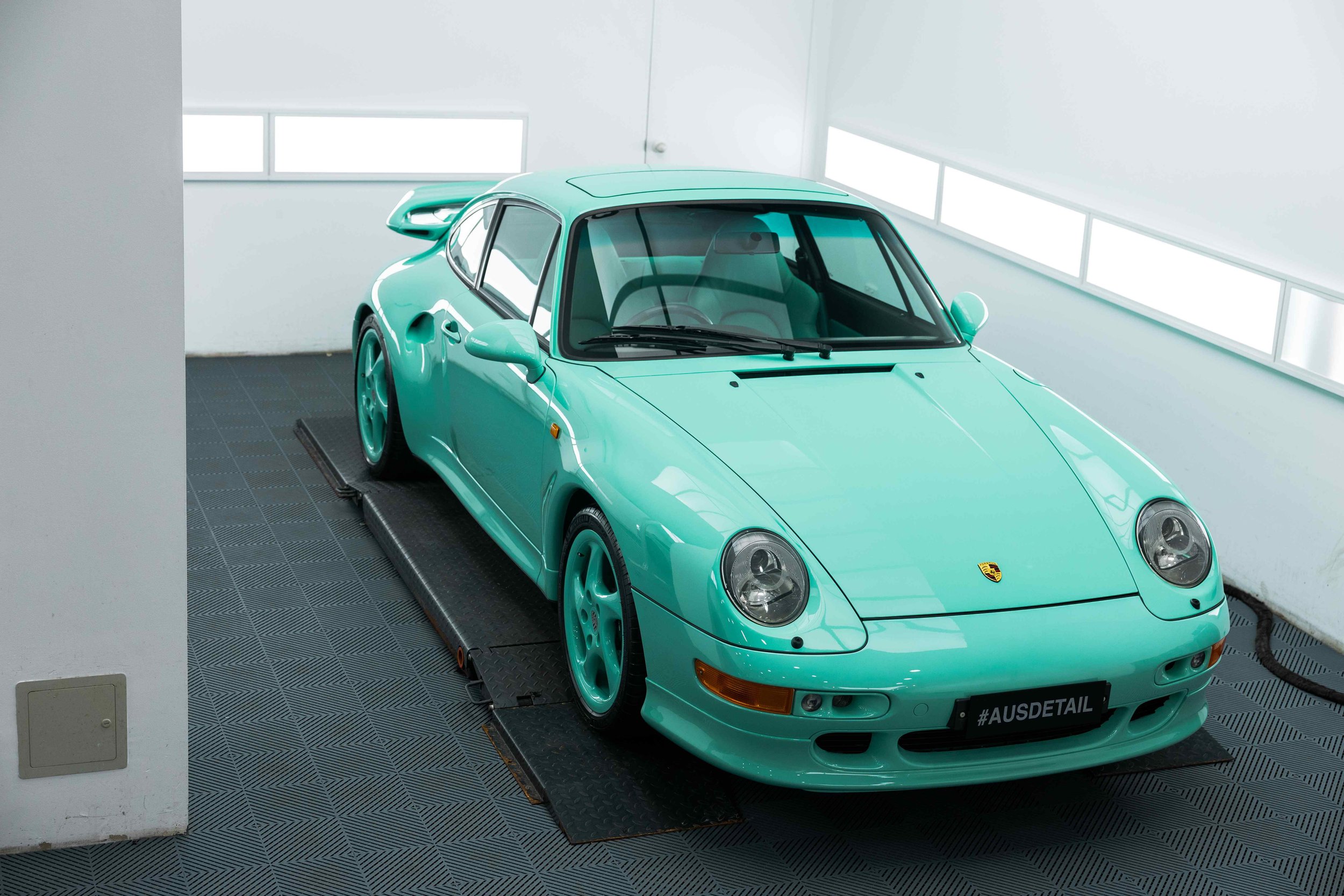 Mint green Porsche 993 front three quarter view with XPEL Paint Protection Film in Mona Vale