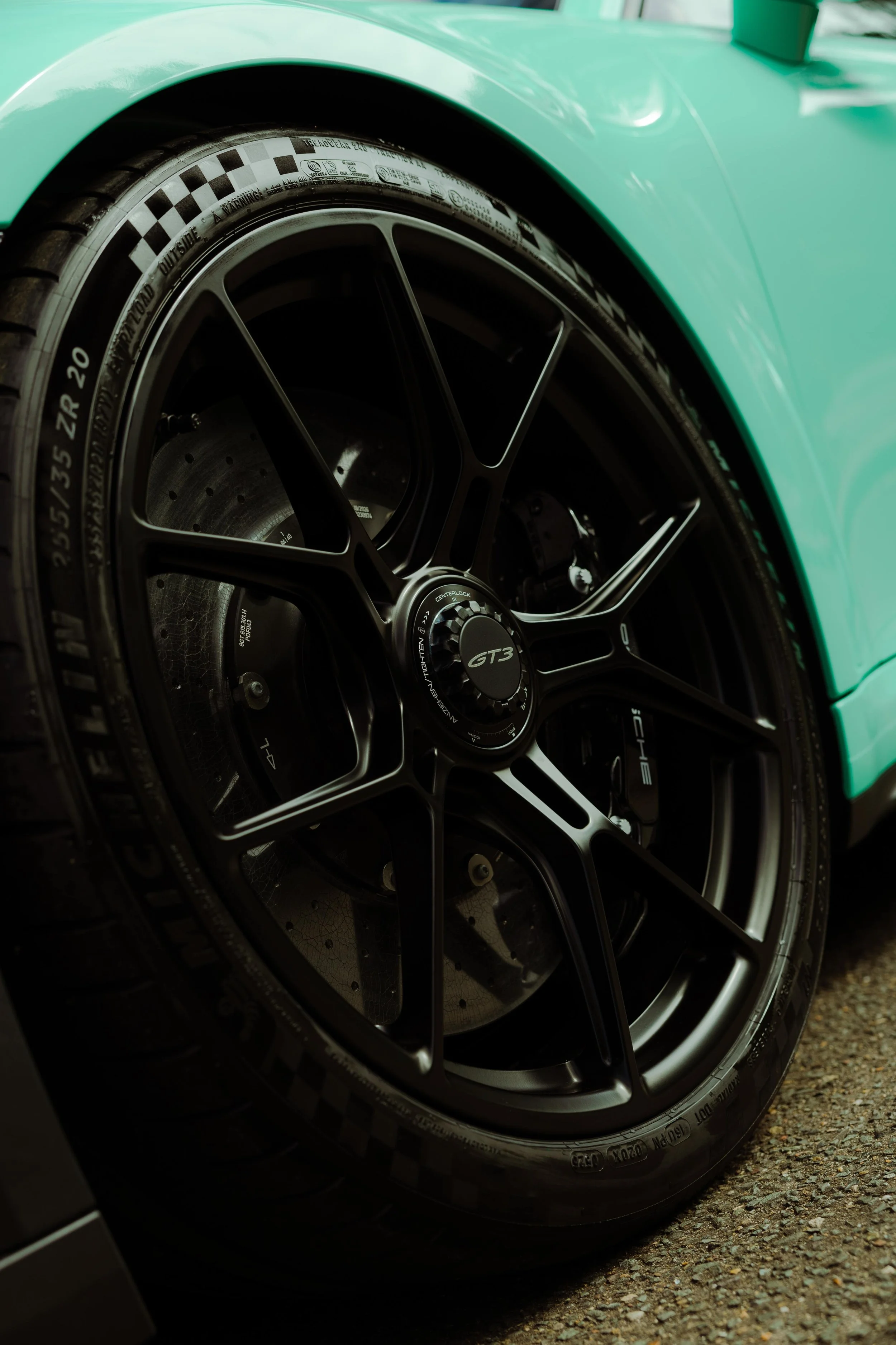 Mint green Porsche 911 GT3 front guard and black wheel with XPEL Paint Protection Film in Sydney