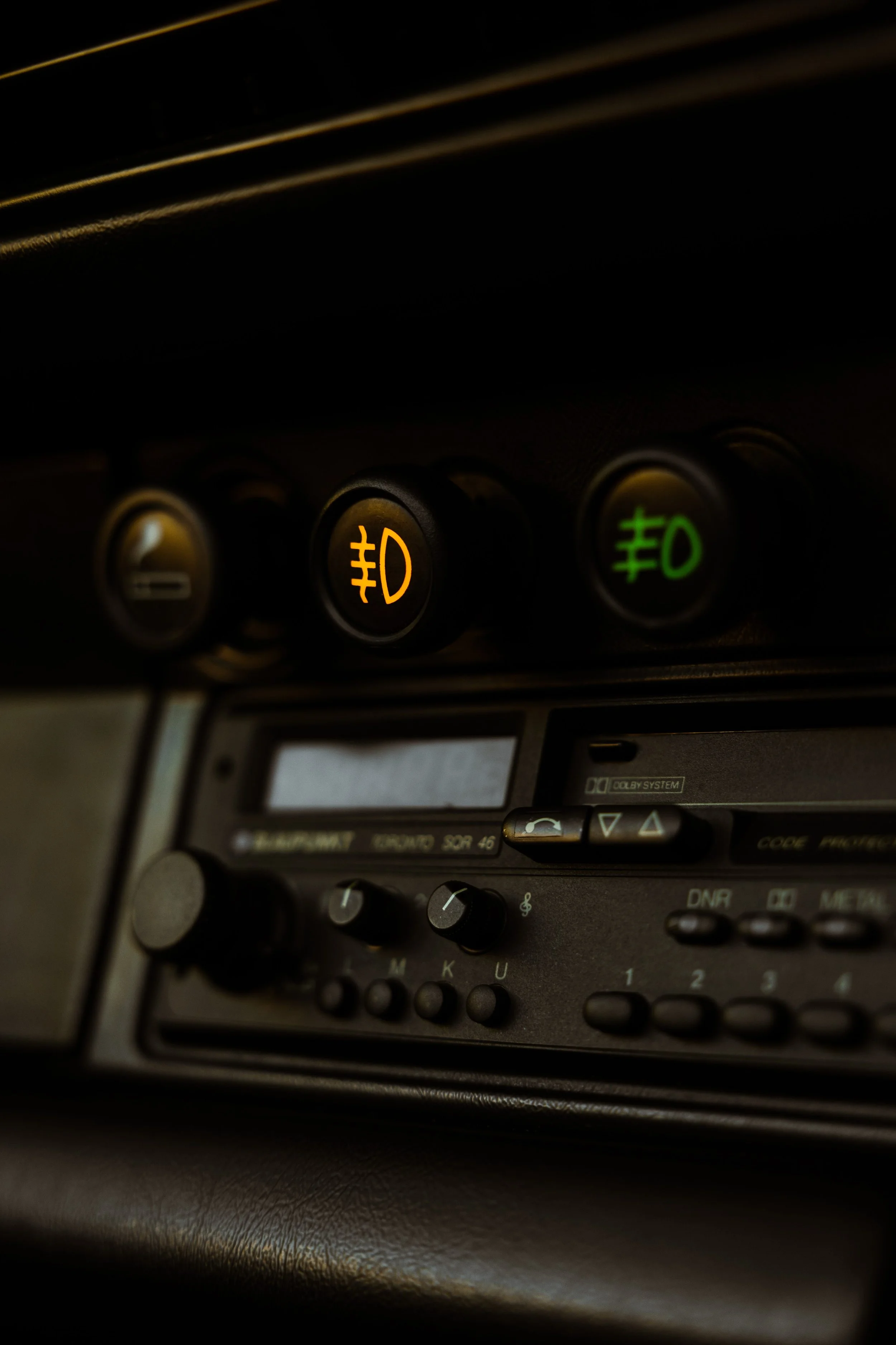 Silver 1989 Porsche 911 Carrera Targa interior detailing fog light switches and period radio in Sydney