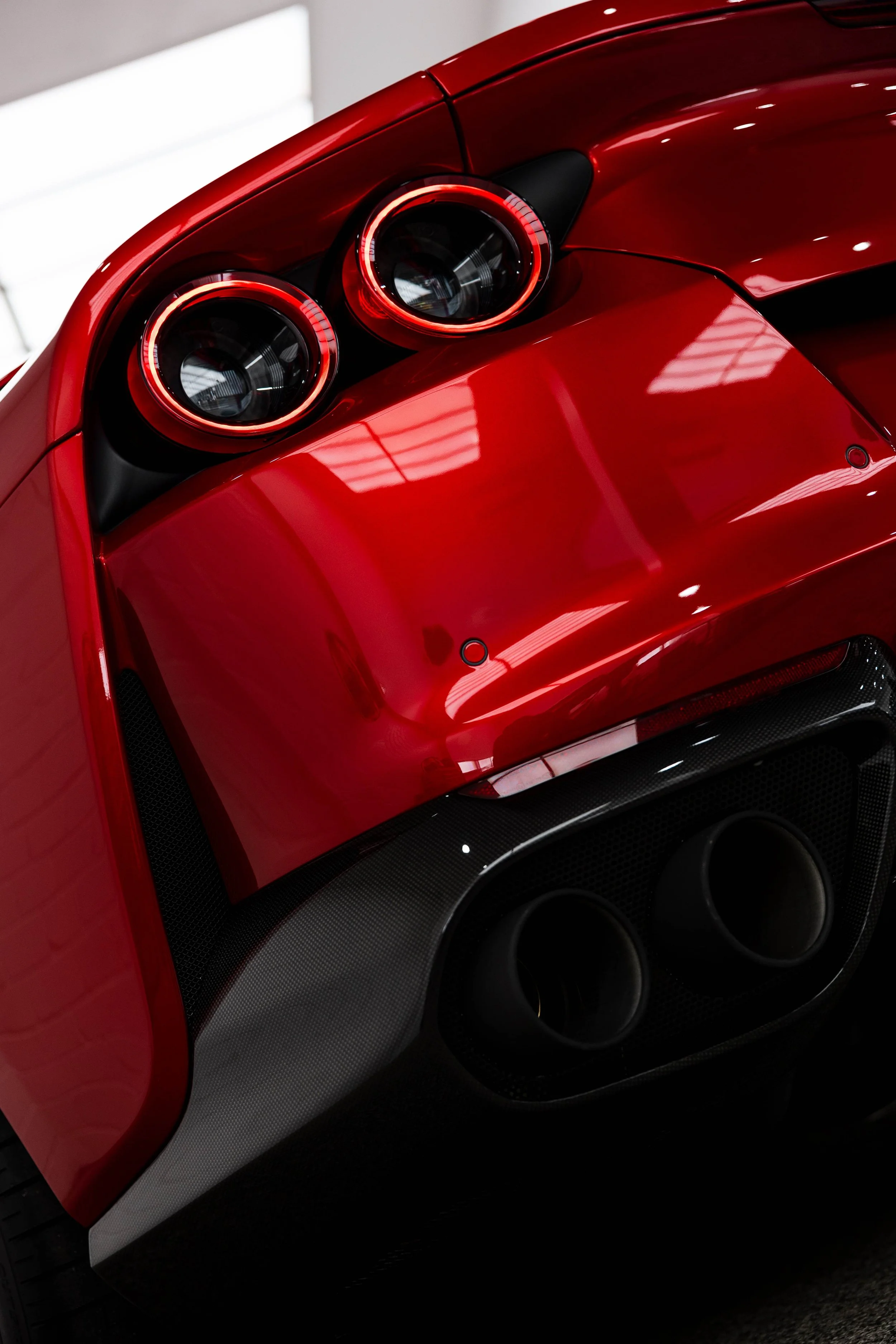 Red Ferrari 812 GTS quad taillight detail with XPEL Paint Protection Film in Sydney