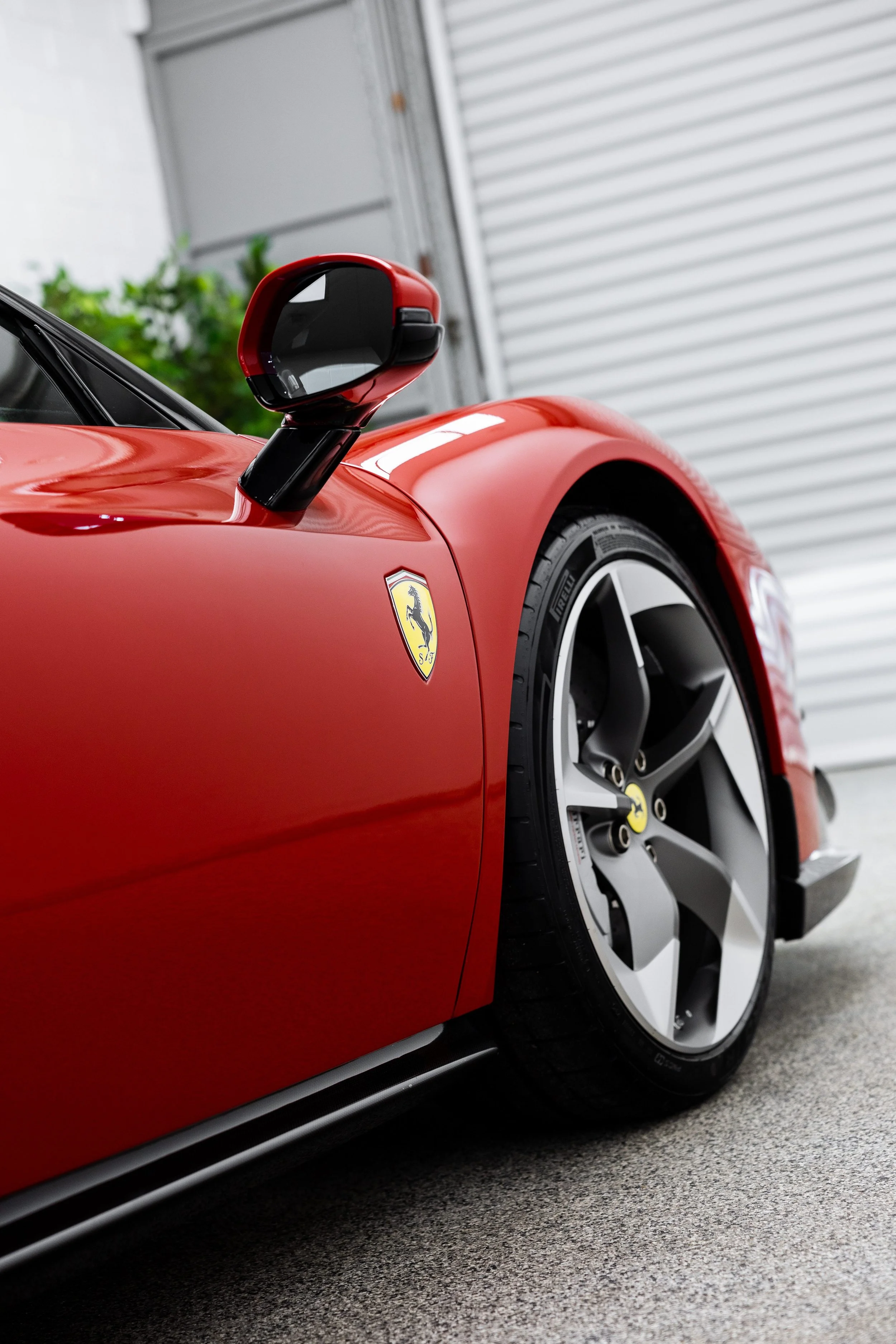 Ferrari badge on red 849 Testarossa front wheel arch with XPEL Paint Protection Film in Sydney