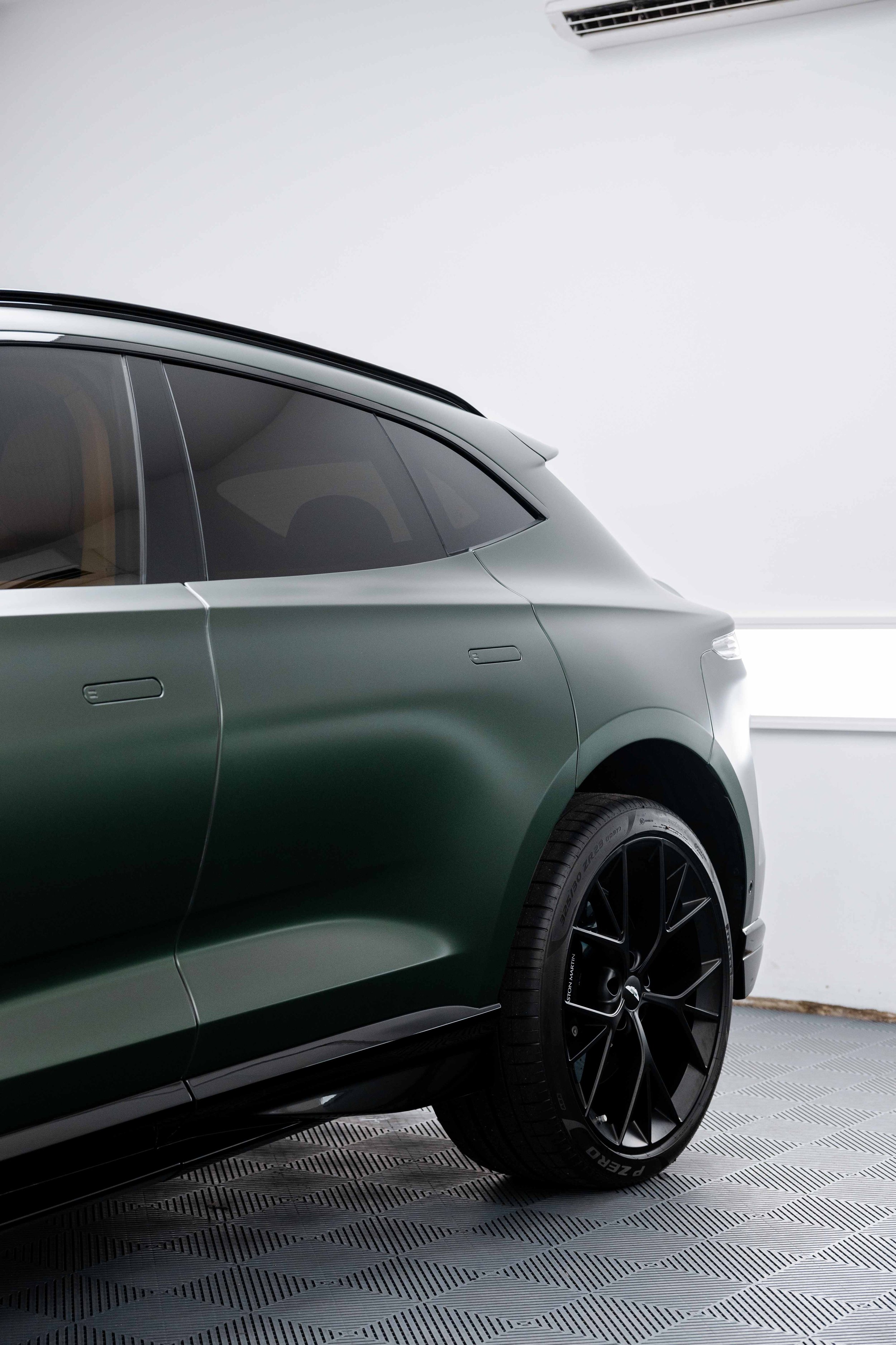 Matte green Aston Martin DBX side profile and wheel with XPEL Stealth Paint Protection Film in Mona Vale