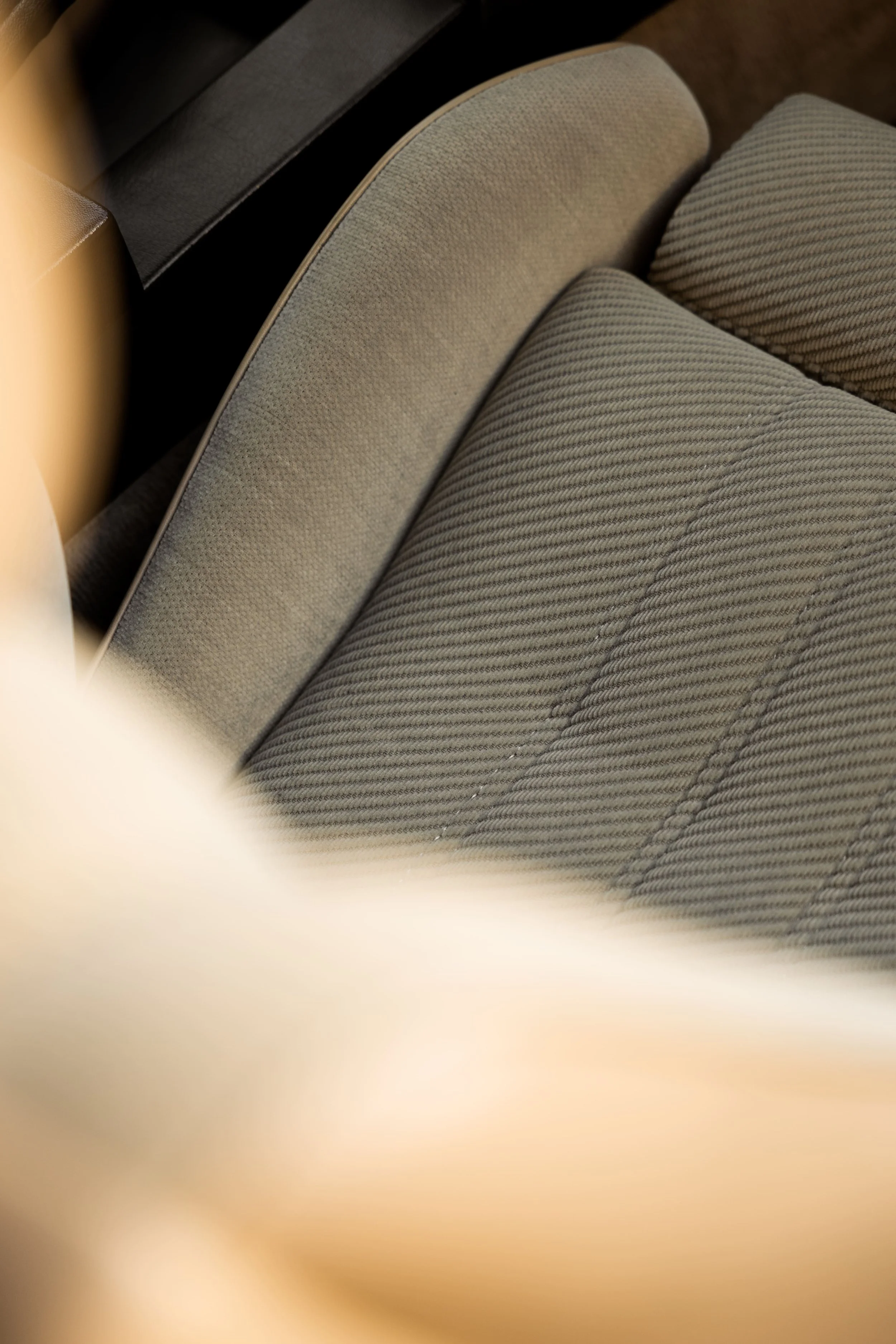 BMW E30 interior seat detail showing original fabric upholstery and stitching, highlighting classic materials carefully restored by Australian Detailing Services Sydney