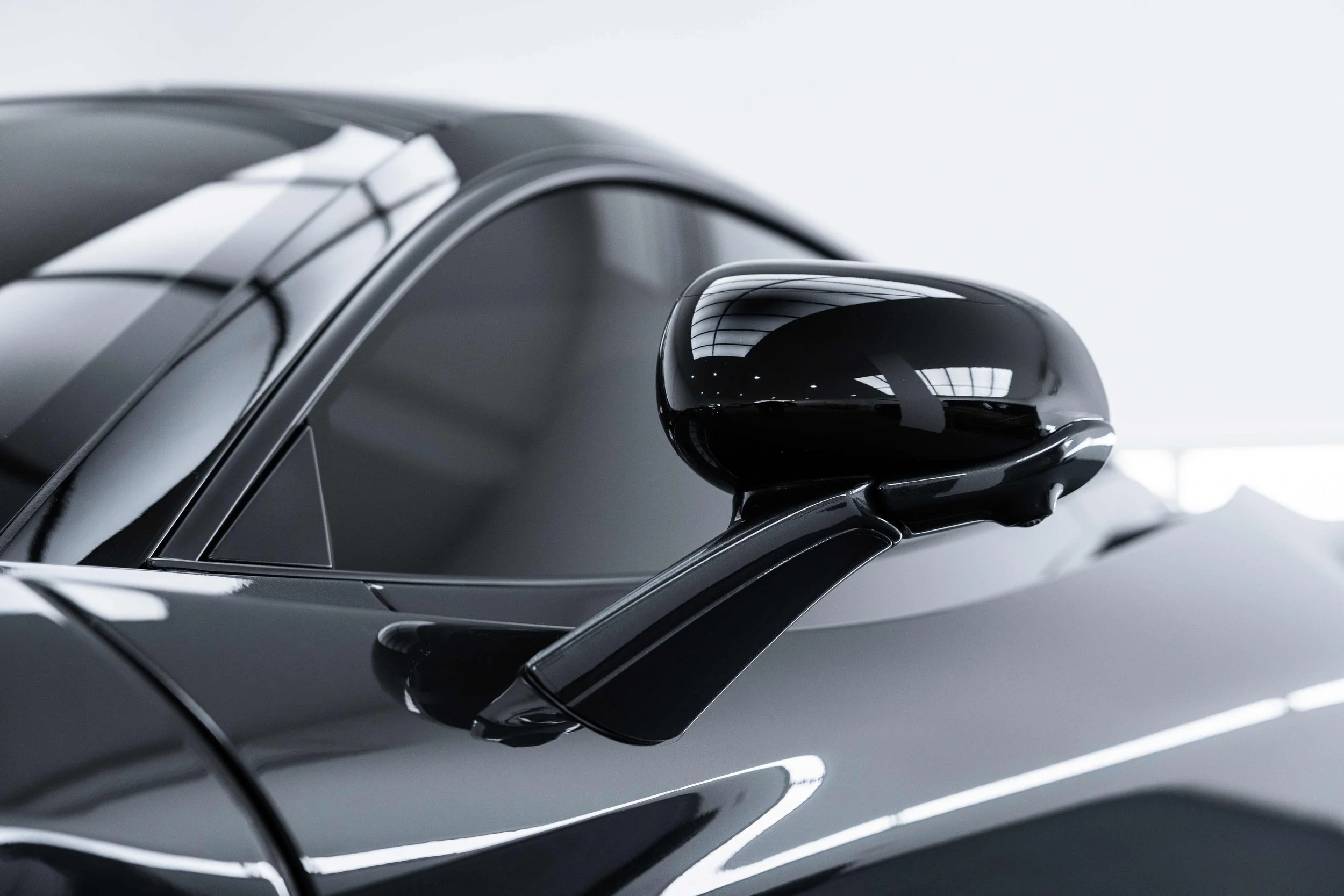 Black McLaren 750S roofline and dihedral door mirror with XPEL Paint Protection Film in Mona Vale