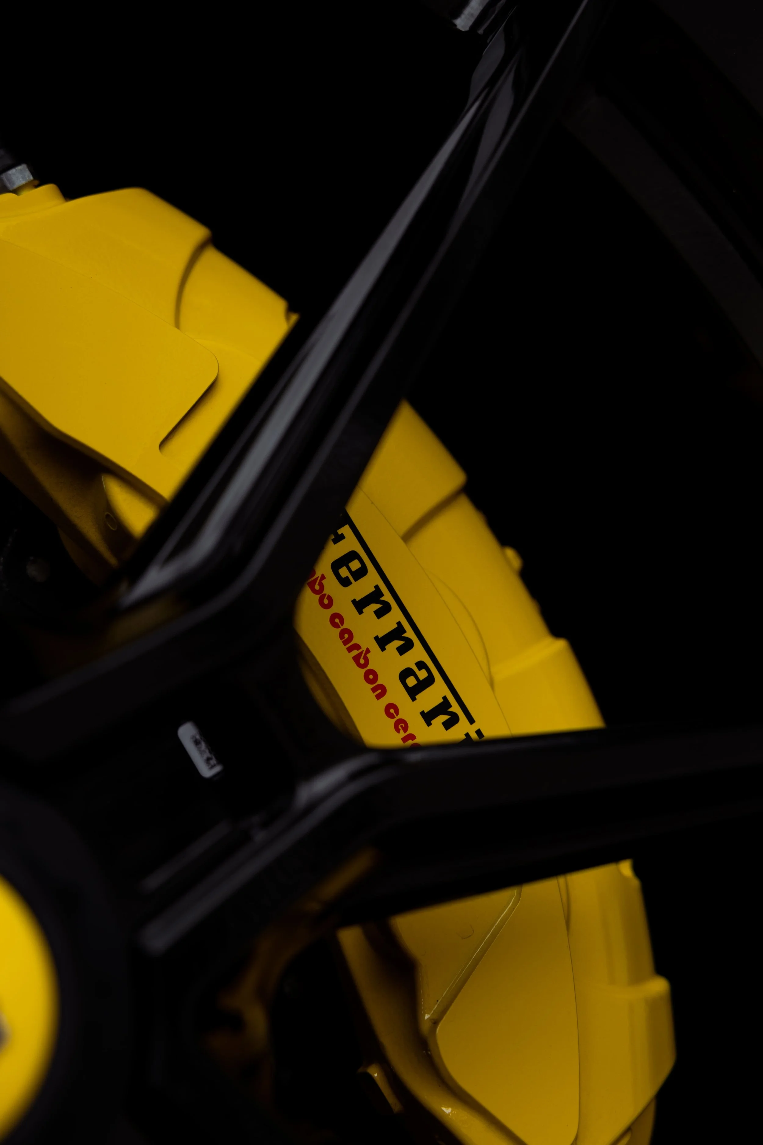 Ferrari Purosangue yellow brake caliper and wheel detail showcasing carbon ceramic braking system with PPF protection by Australian Detailing Services Sydney