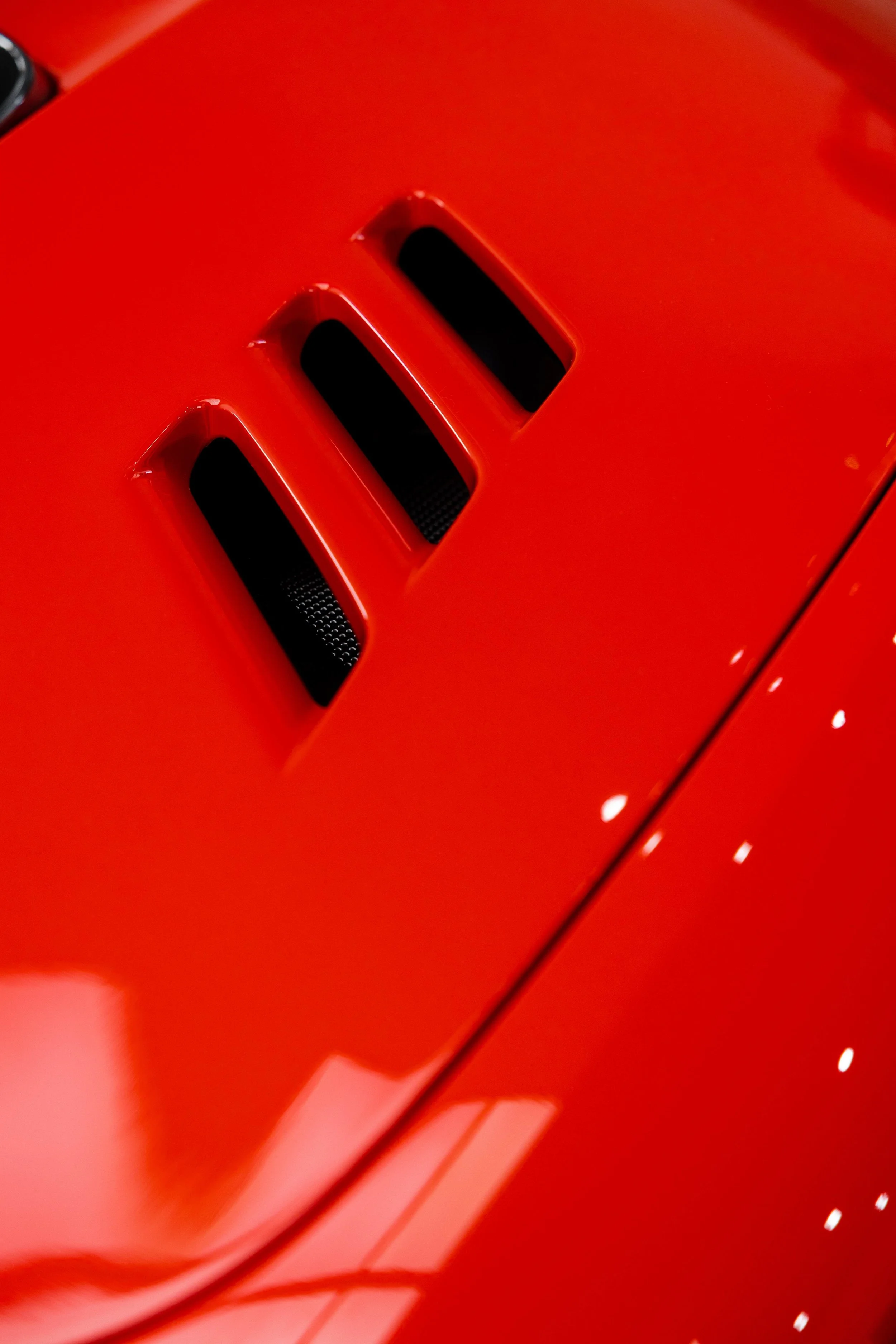 Red Ferrari 296 Speciale front guard vents with XPEL Paint Protection Film in Mona Vale