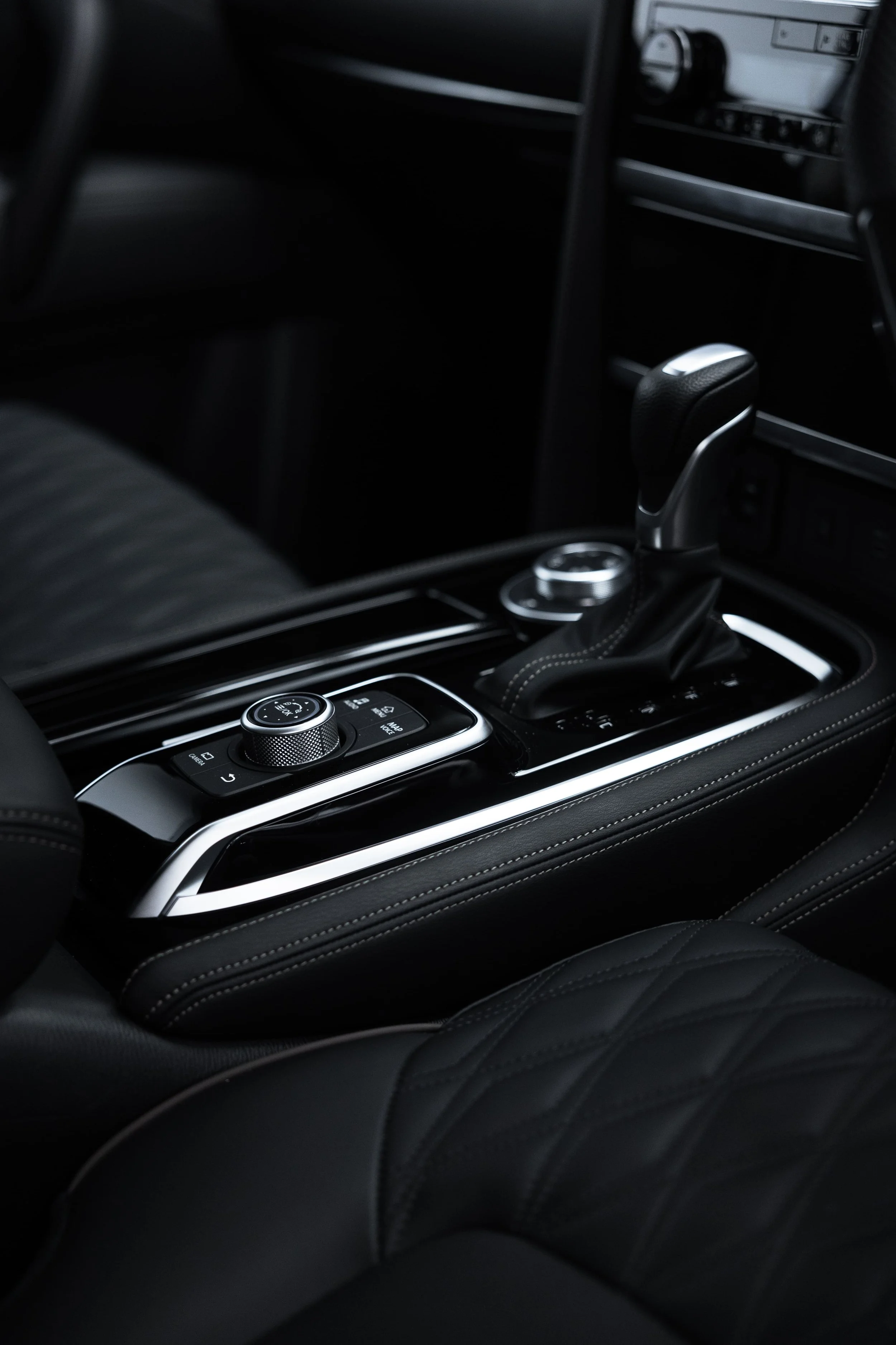 Center console of Y62 Nissan Patrol with gear selector and controls after interior detailing by ADS in Sydney