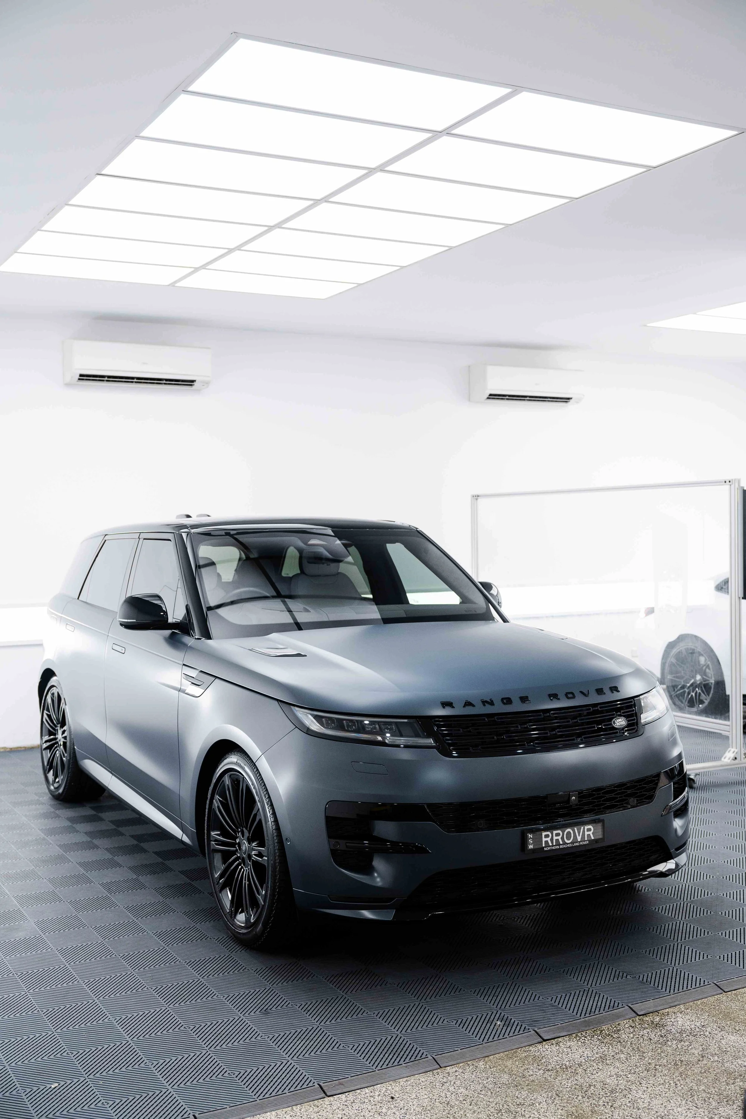 Matte grey Range Rover Sport front three quarter view with XPEL Stealth Paint Protection Film in Mona Vale