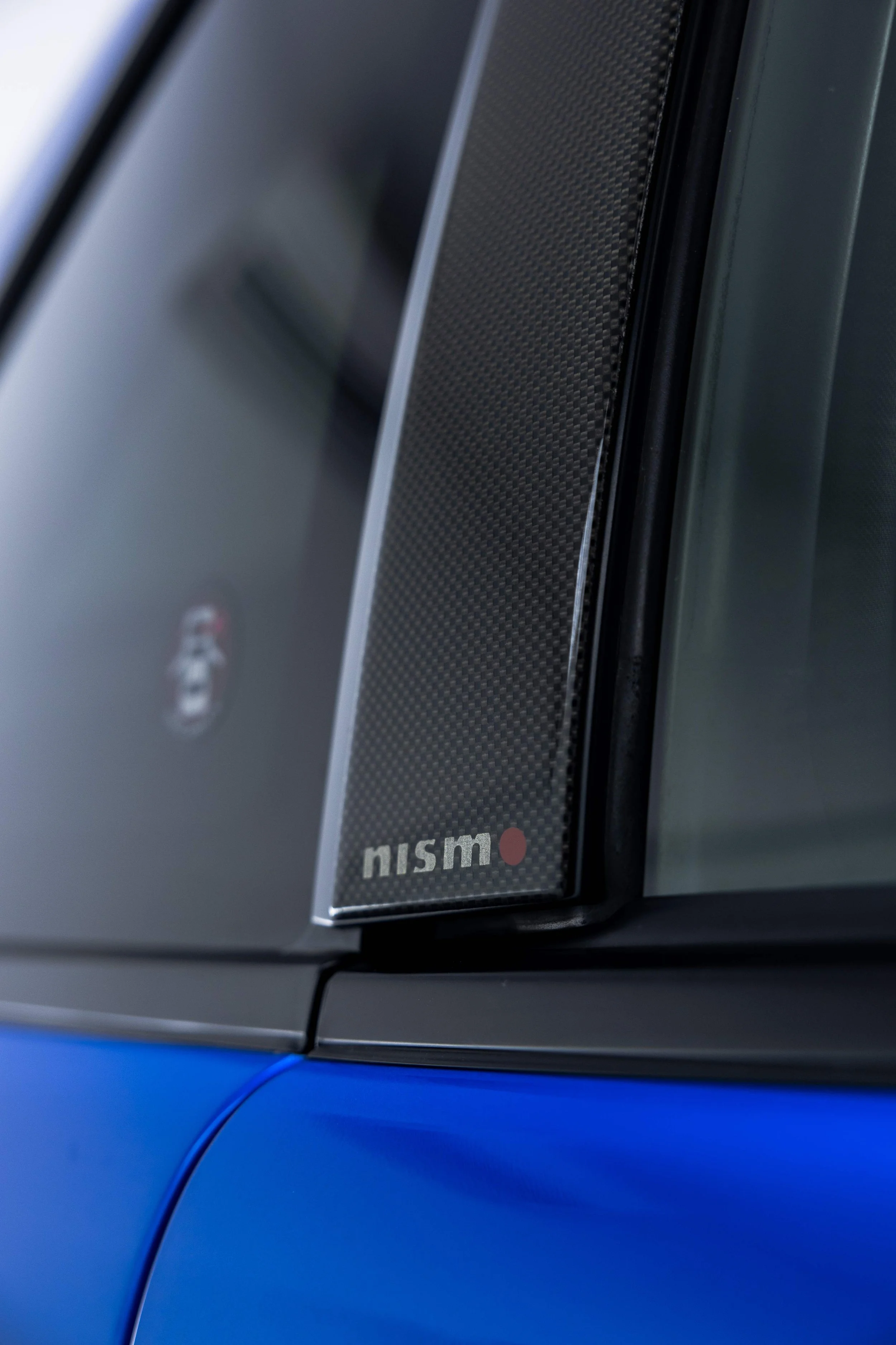 Nismo badge on Nissan R34 GT-R Nur B pillar with XPEL Paint Protection Film in Sydney